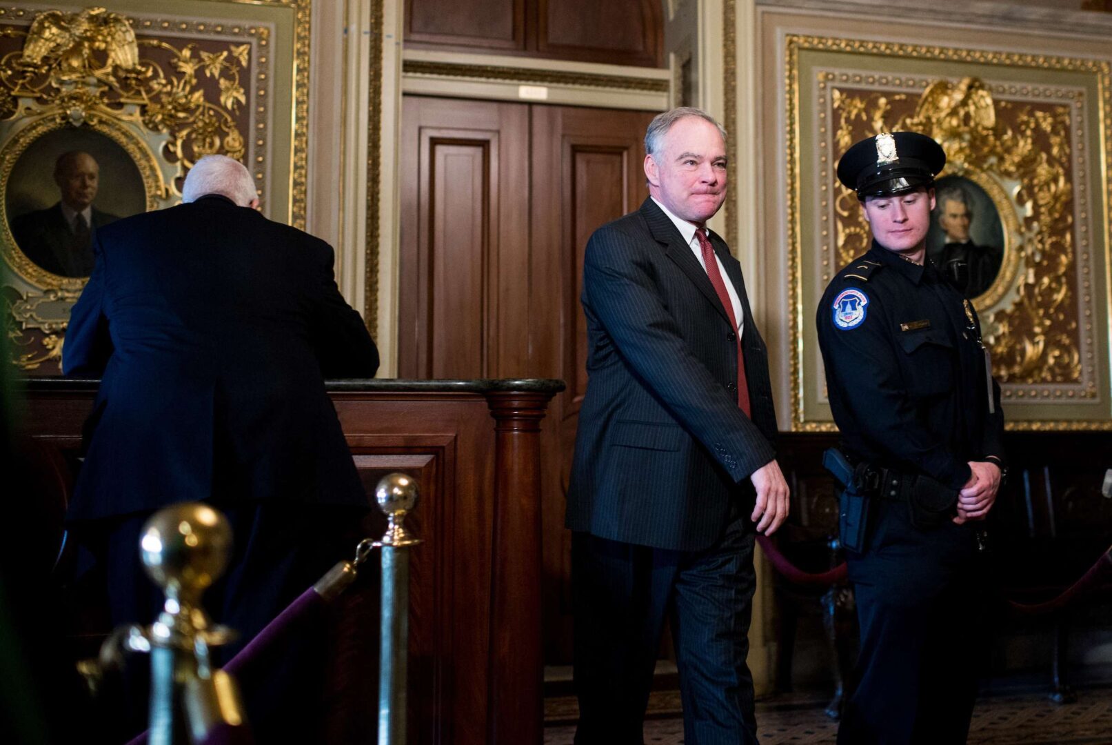 Sen. Tim Kaine, D-Va., walks through the Senate Reception Room to the Senate chamber.
