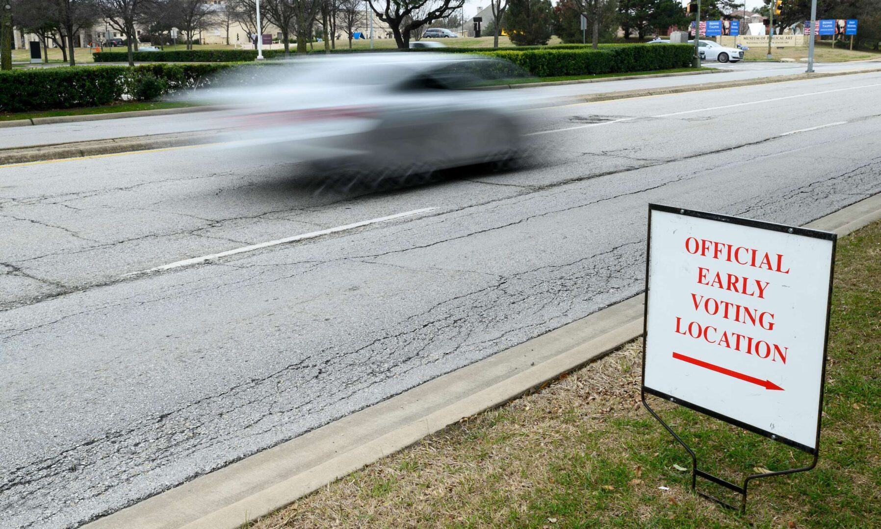 A sign points the way to the early voting location at Our Redeemer Lutheran Church in Dallas.
