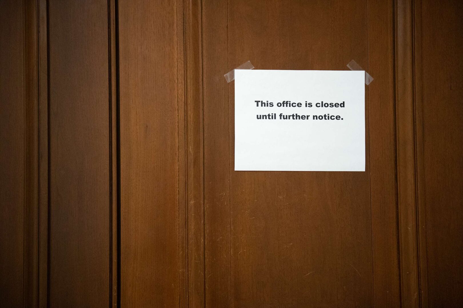 Despite an uptick of infections in the Capitol community, leaders are not providing clear guidance on what comes next, or who even makes the call. 