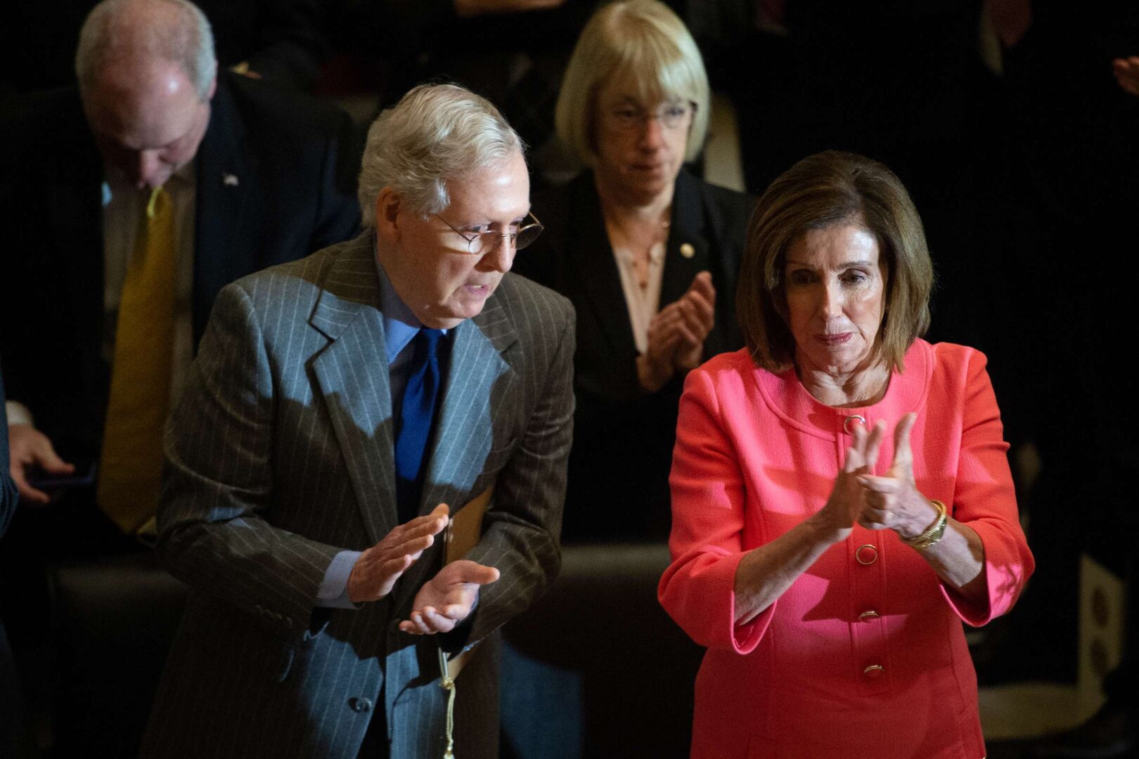 Senate Majority Leader Mitch McConnell talks with Speaker of the House Nancy Pelosi during the Congressional Gold Medal Ceremony in honor of Steve Gleason on Jan. 15, 2020.