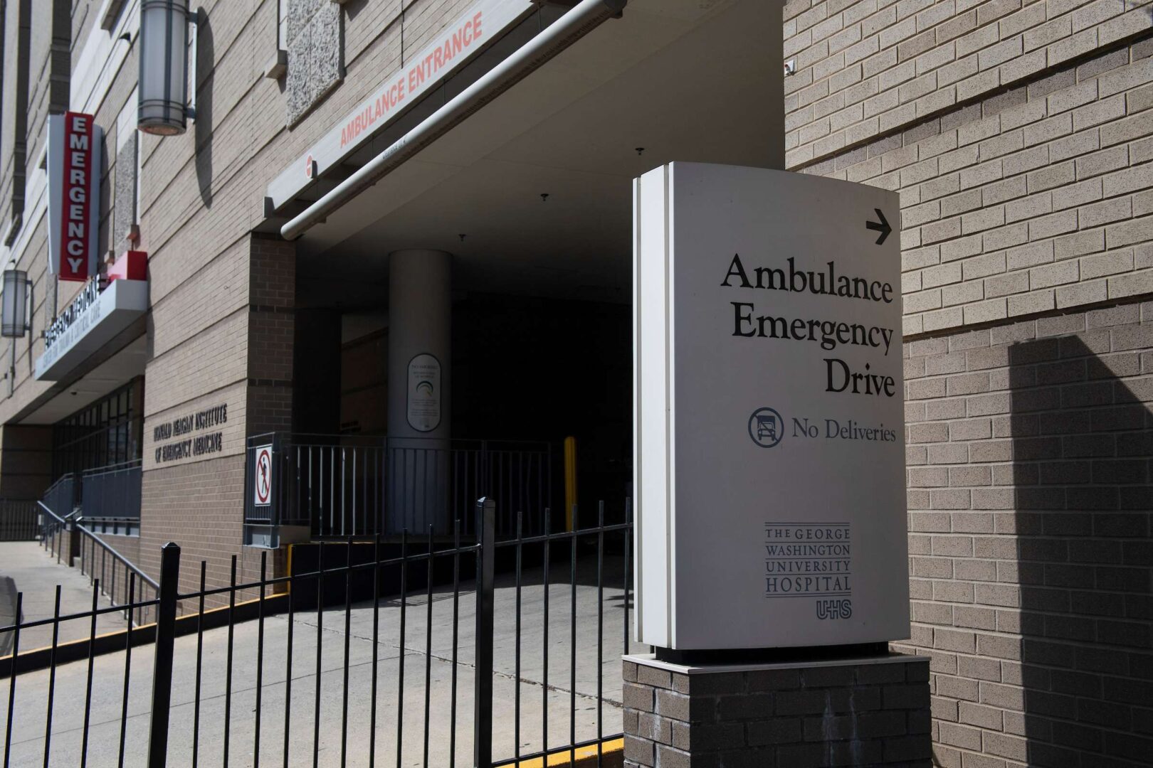 The George Washington University Hospital emergency entrance in Washington on Monday.  Hospitals, urgent care centers, nursing homes, and other health care facilities could deny leave to medical workers, even if they’ve been exposed, because of coronavirus-related emergencies. 