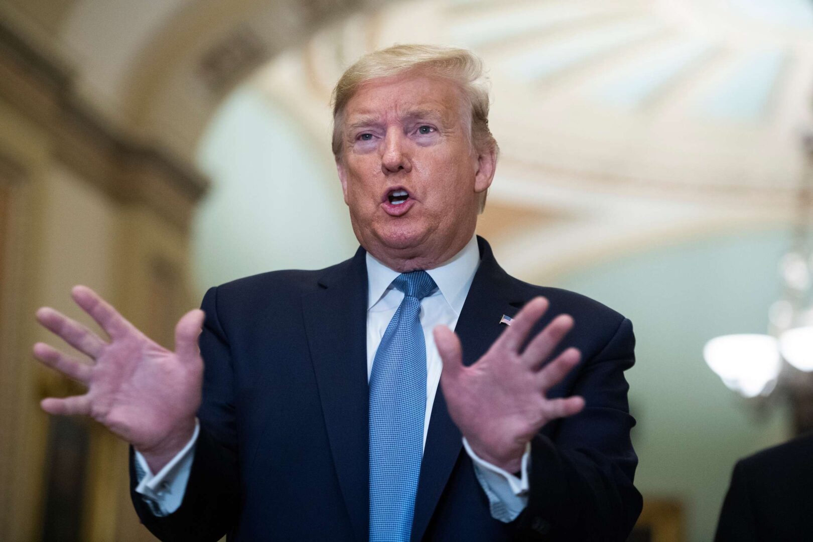 President Donald Trump makes remarks to the media in the Capitol after attending the Senate Republican Policy luncheon on March 10. (Tom Williams/CQ Roll Call)