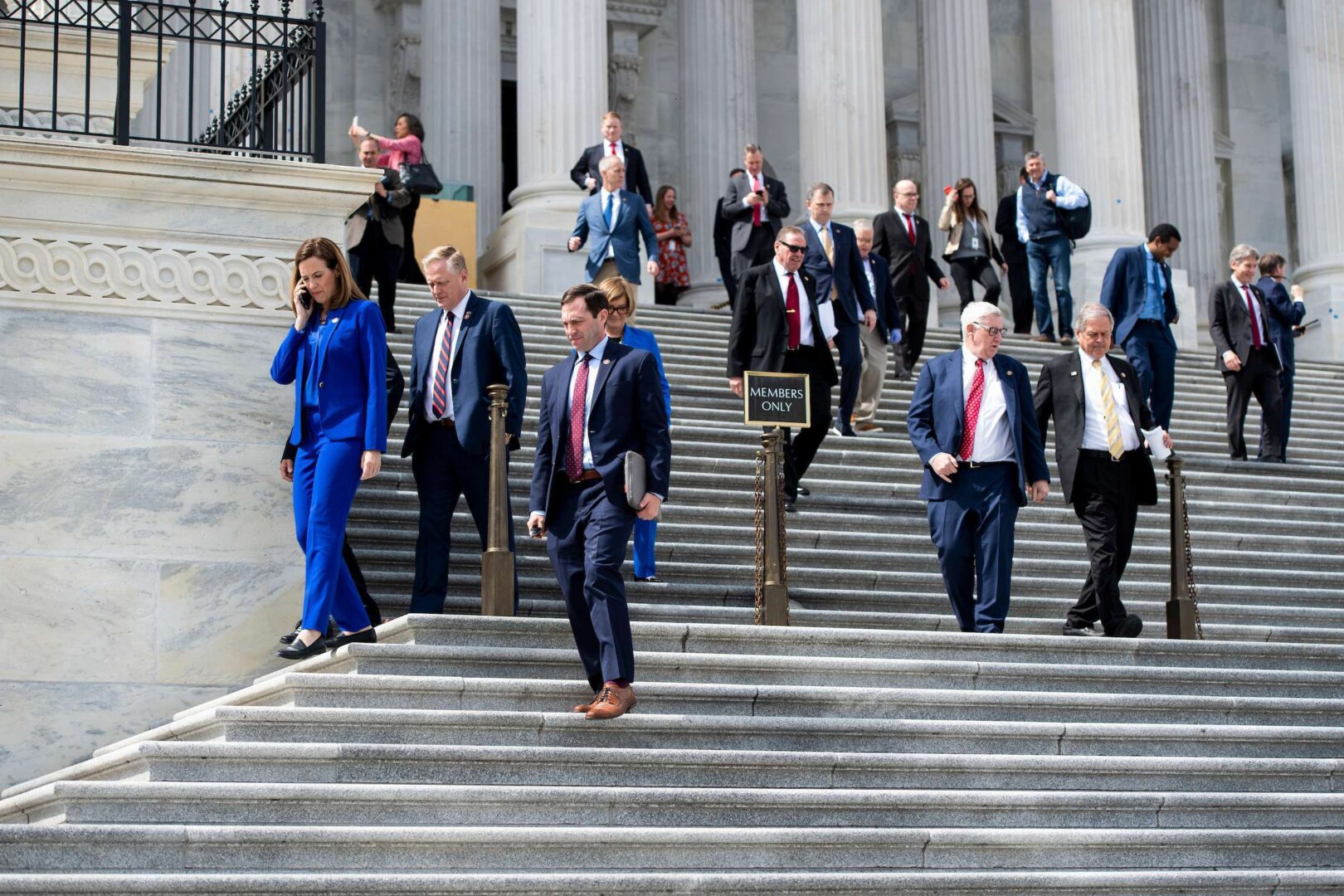 Members of Congress stream out of the Capitol after passing the Coronavirus Aid, Relief, and Economic Security Act on Friday, March 27, 2020. (Bill Clark/CQ Roll Call)