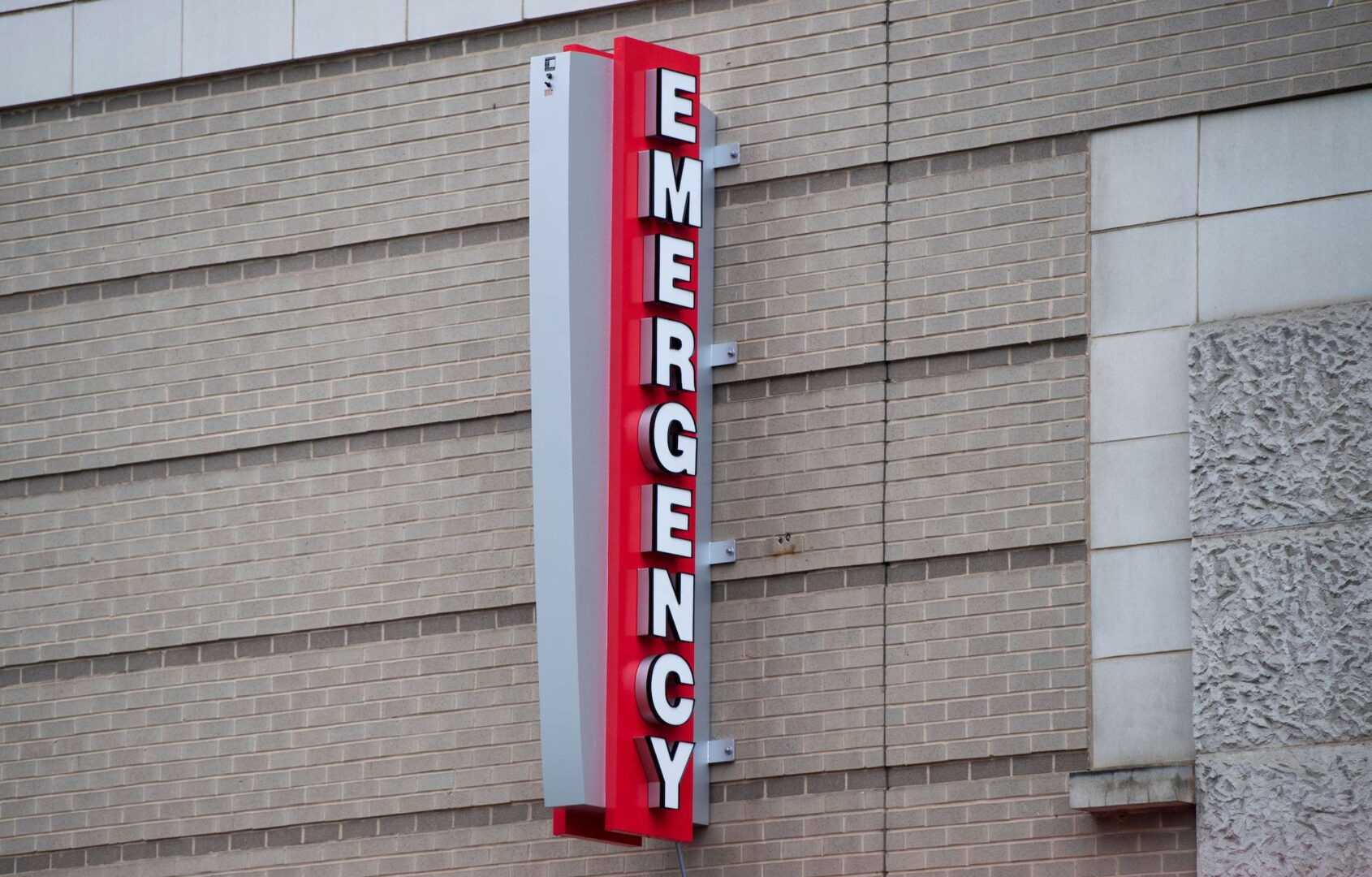 A sign marks the entrance to the emergency room at the George Washington University Hospital in Washington on March 23, 2020. 