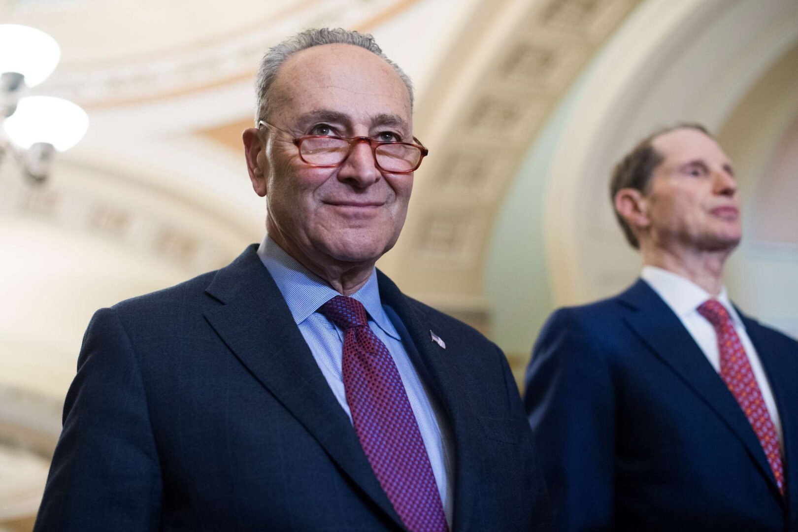 Senate Minority Leader Charles Schumer, D-N.Y., left, and Sen. Ron Wyden, D-Ore., want unemployment checks out the door quickly. (Tom Williams/CQ Roll Call file photo)