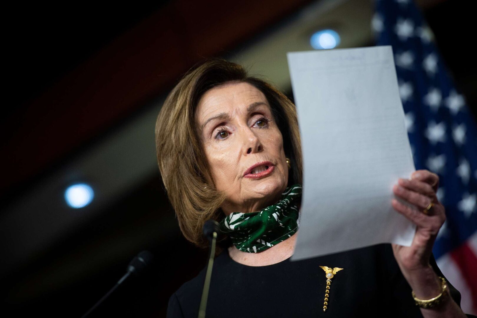 Speaker Nancy Pelosi reads a letter she wrote to members about the latest coronavirus relief bill during her weekly news conference on Capitol Hill on Thursday.