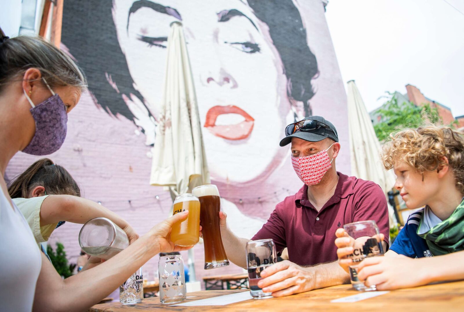 UNITED STATES - MAY 29: James Wedekind and his wife, Jessica, of Springfield, Va., sit with their children at Dacha Beer Garden in the Shaw neighborhood on the first day of the phase one reopening of Washington, D.C., on Friday, May 29, 2020. Washington has lifted the stay-at-home order that was in place due to the COVID-19 pandemic and allowed certain businesses to reopen. (Photo By Tom Williams/CQ Roll Call)