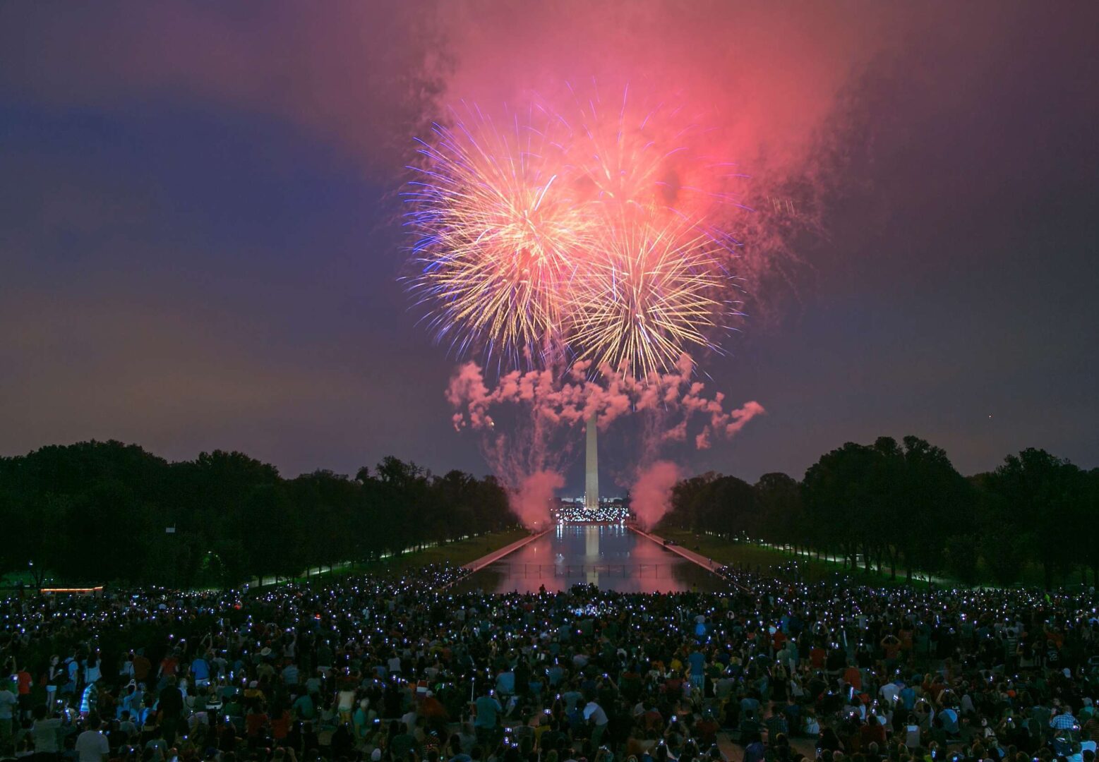 UNITED STATES - JULY 4 - Thousands of tourists and spectators use their smart phones and cameras to document fireworks as they explode over the National Mall for Fourth of July celebrations in Washington, photographed from Lincoln Memorial on Saturday, July 4, 2015. (Photo By Al Drago/CQ Roll Call)