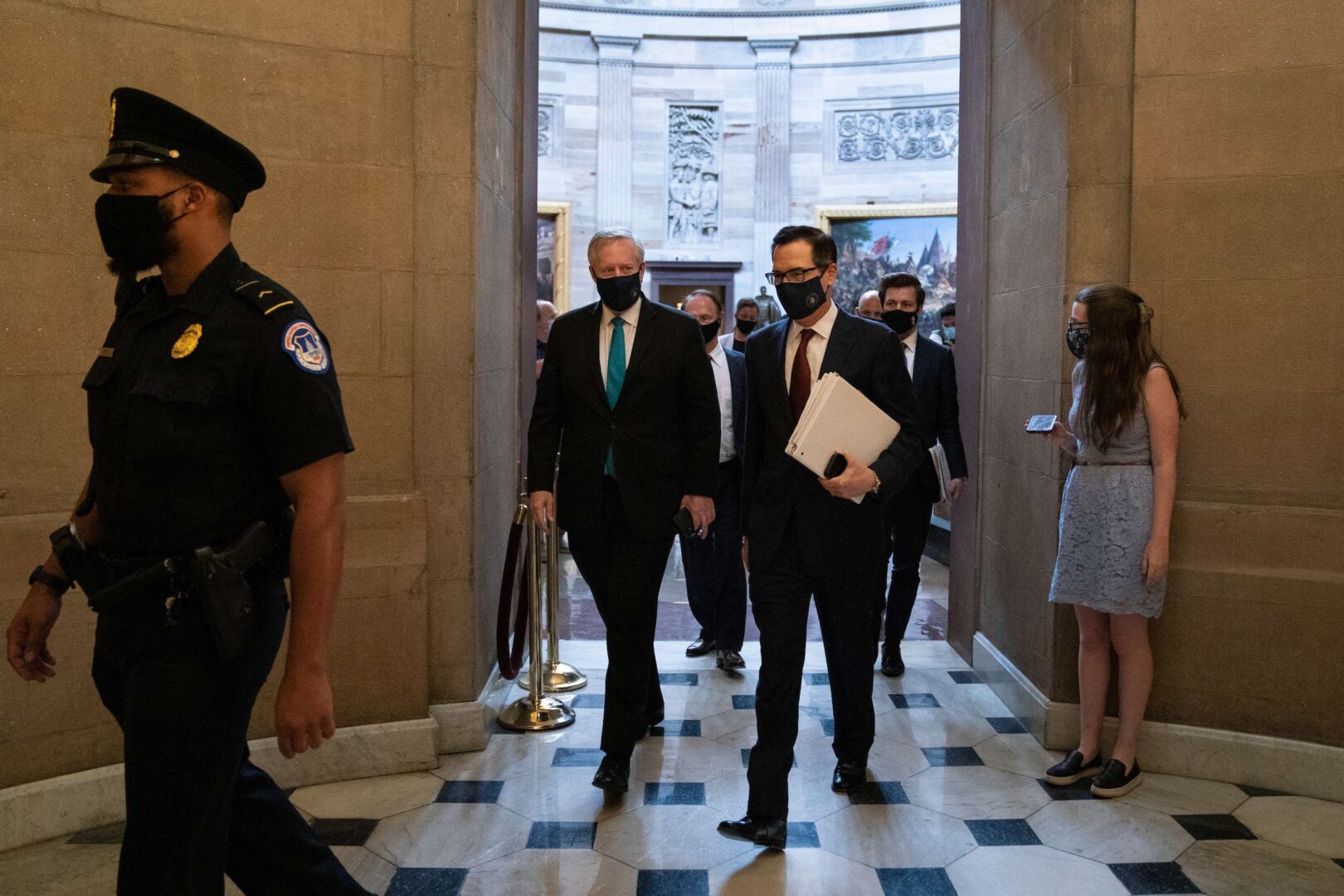 White House Chief of Staff Mark Meadows, left, and Treasury Secretary Steven Mnuchin arrive for a meeting with Speaker Nancy Pelosi and Senate Minority Leader Charles E. Schumer in the Capitol on Wednesday, Aug. 5, 2020. 