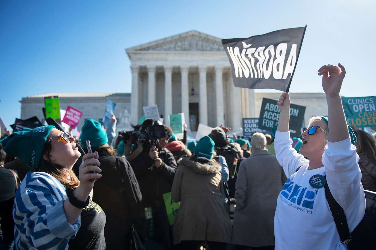 Abortion rights activists protest during a demonstration outside the Supreme Court in Washington on March 4, as the court heard oral arguments regarding a Louisiana law about abortion access. 