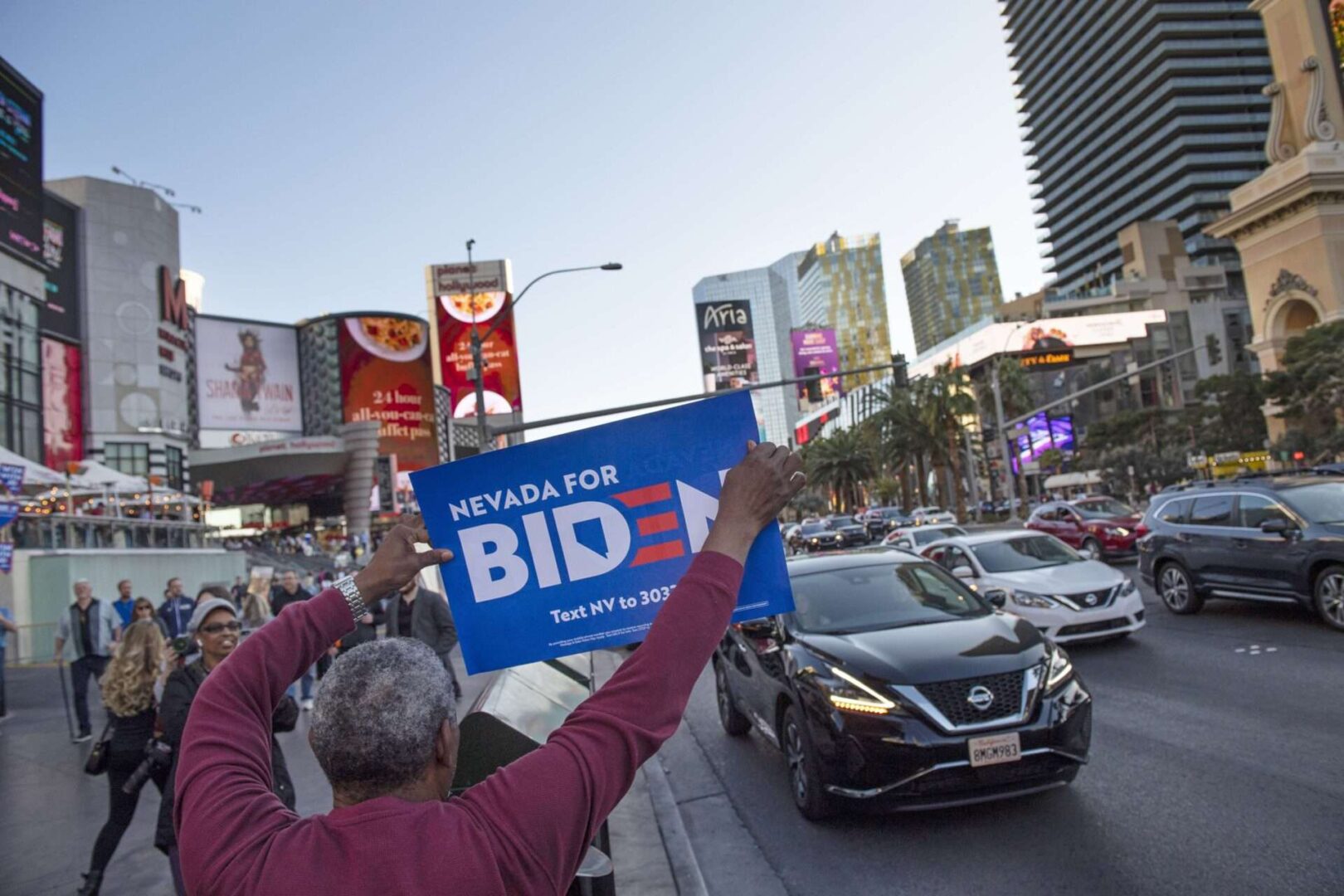 A Biden supporter demonstrates in Las Vegas before a debate in February. Despite a sometimes brutal primary season, Democrats were expected to coalesce in November and that’s exactly what happened, Gonzales writes.