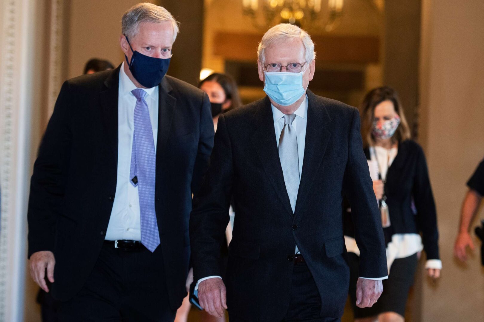 Senate Majority Leader Mitch McConnell, R-Ky., right, and Mark Meadows, White House chief of staff, are seen in the Capitol after a meeting Wednesday.