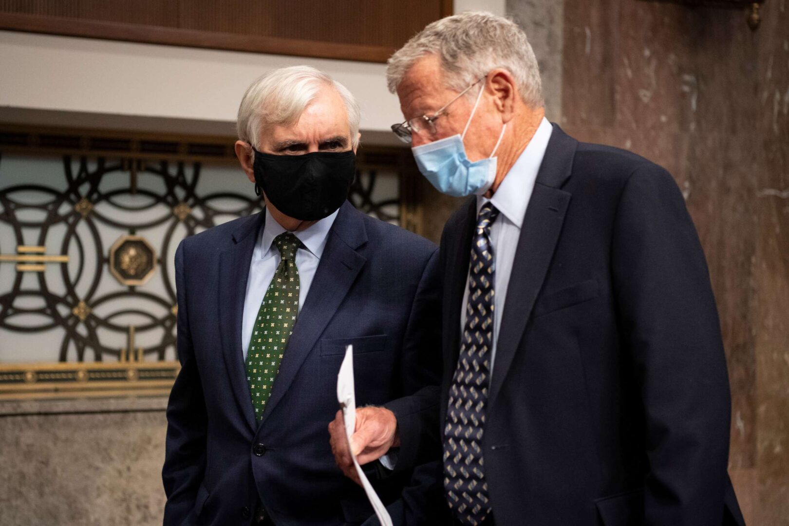 Senate Armed Services Chairman James M. Inhofe, right, and ranking member Jack Reed talk before a committee hearing in September.