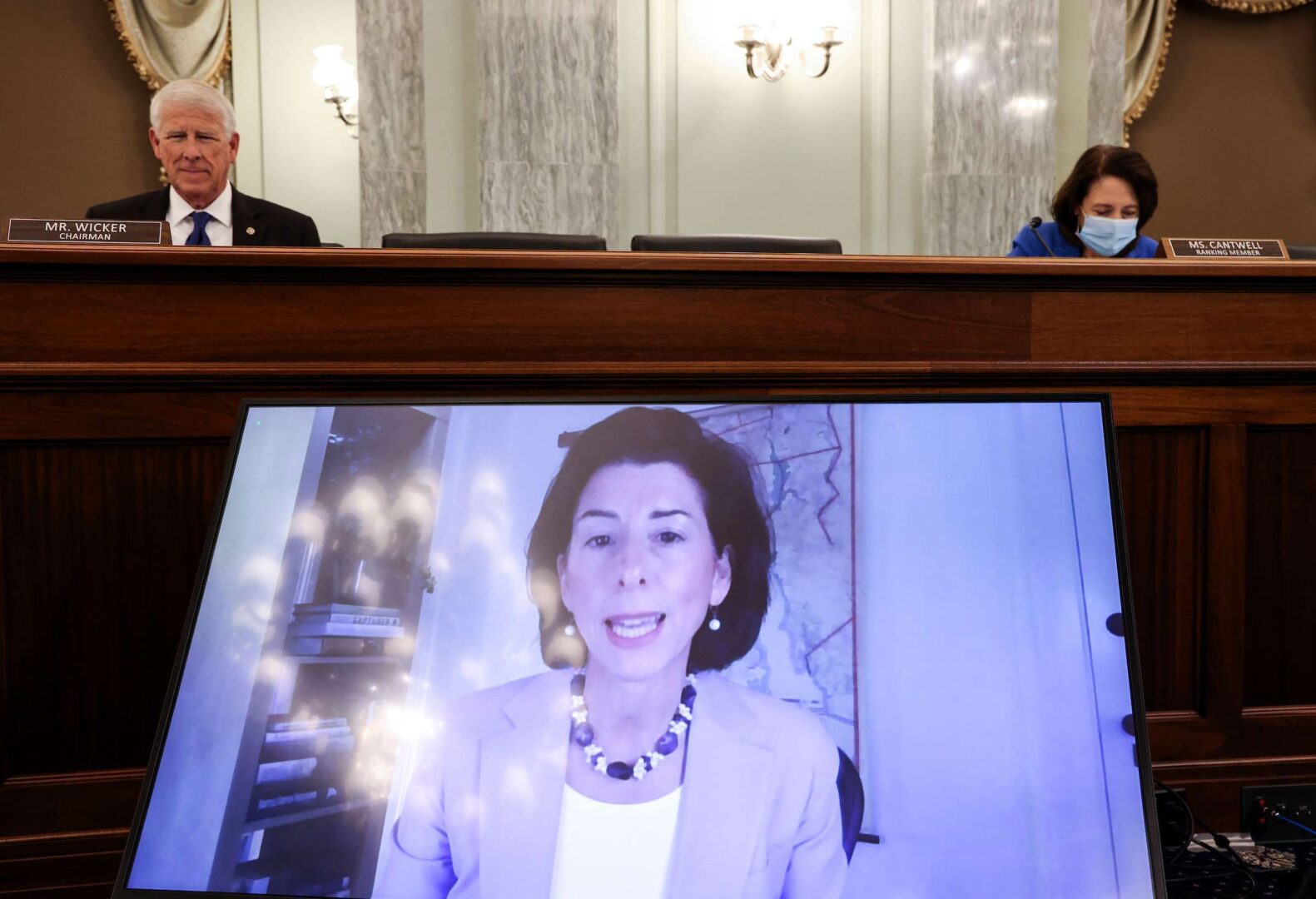 Rhode Island Gov. Gina Raimondo testifies remotely Tuesday during a Senate Commerce, Science and Transportation Committee hearing on her nomination to be Commerce secretary. 