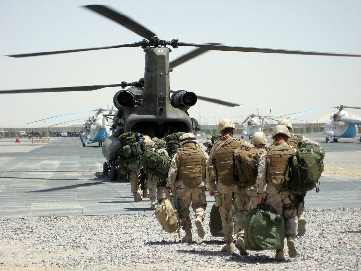 Navy Seabees board a military helicopter for transportation to build Special Forces camps at undisclosed locations in Afghanistan in 2009.