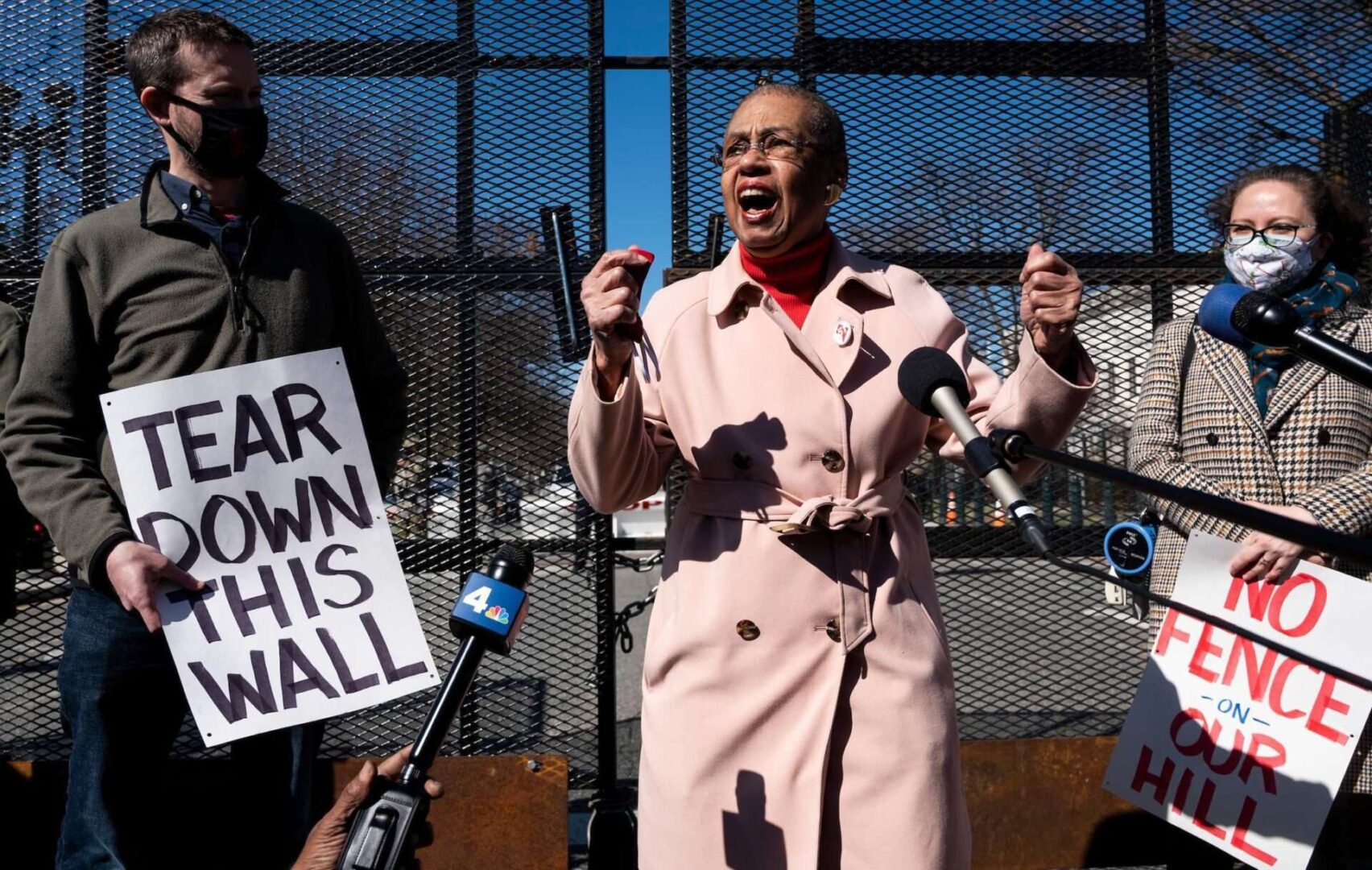 D.C. Del. Eleanor Holmes Norton speaks to reporters as Ward 6 Councilman Charles Allen, left, listens outside the U.S. Capitol security fencing during a protest on March 13, 2021.