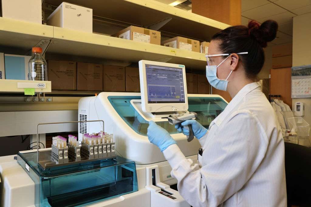 A laboratory scientist tests serology samples from the Novavax phase 3 Covid-19 clinical vaccine trial at the University of Washington Medicine Retrovirology Lab at Harborview Medical Center in February in Seattle.