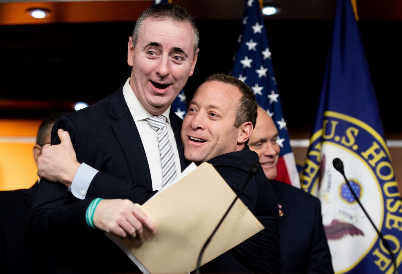 House Problem Solvers Caucus leaders Brian Fitzpatrick, R-Pa., left, and Josh Gottheimer, D-N.J., embrace during a press conference on Feb. 11, 2020. The bipartisan caucus unveiled a new, $1.25 trillion infrastructure spending framework on Wednesday. 