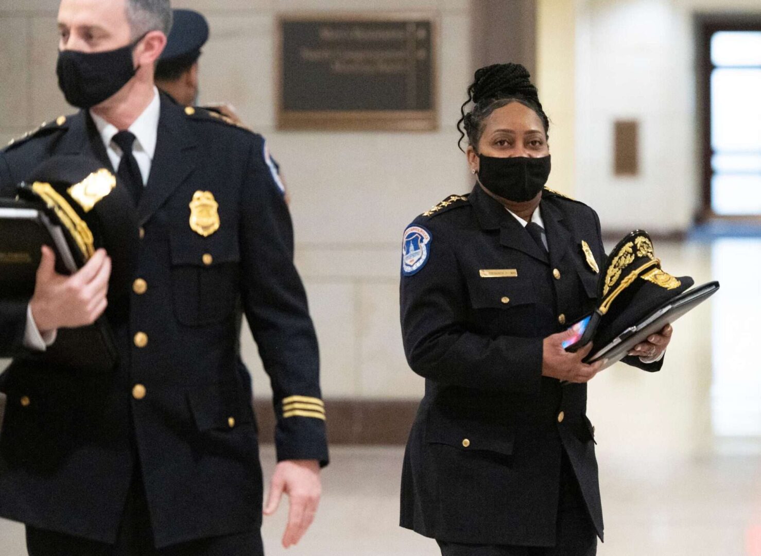 Acting Assistant Chief Sean Gallagher, left, and acting Chief of the U.S. Capitol Police Yogananda Pittman arrive for a session of the Capitol security task force briefing in the Capitol Visitor Center on March 8.