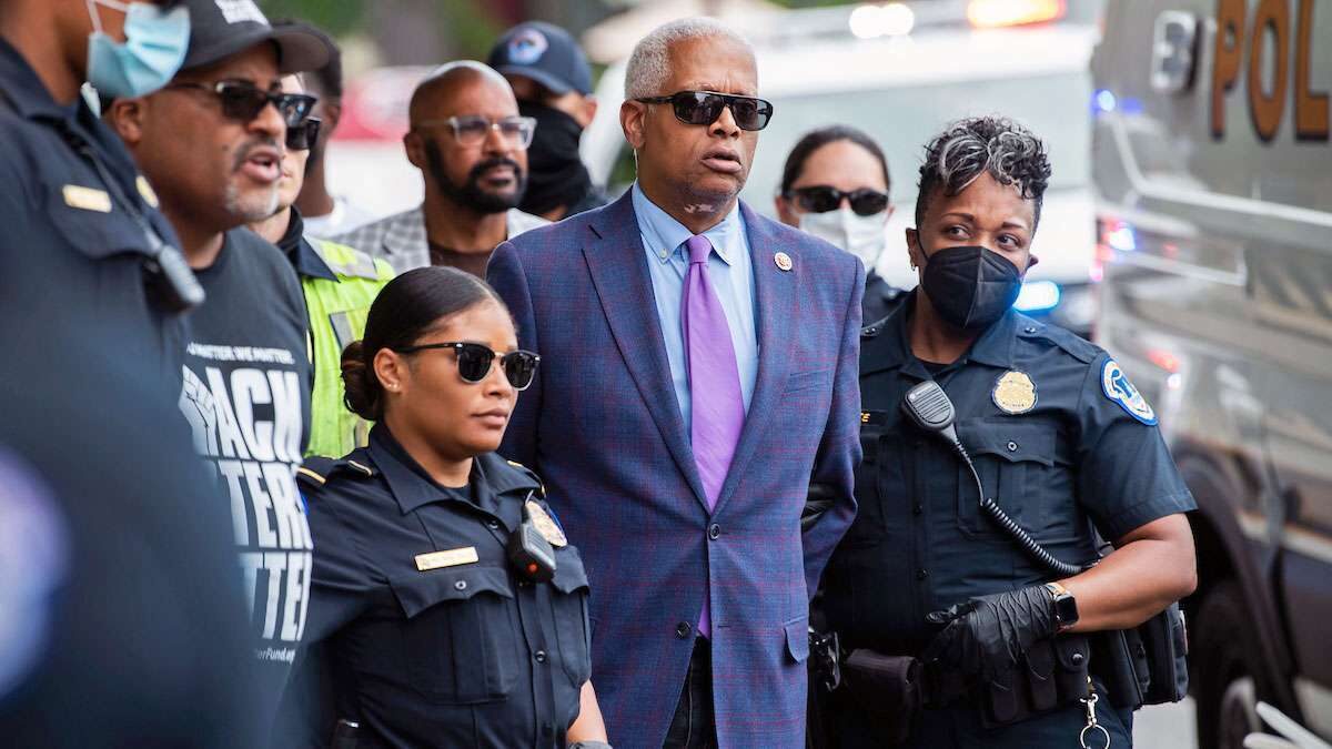 Rep. Hank Johnson, center, and Cliff Albright, second from left, co-founder of Black Voters Matter, are arrested during a protest to support voting rights outside the Hart Building on Thursday. 