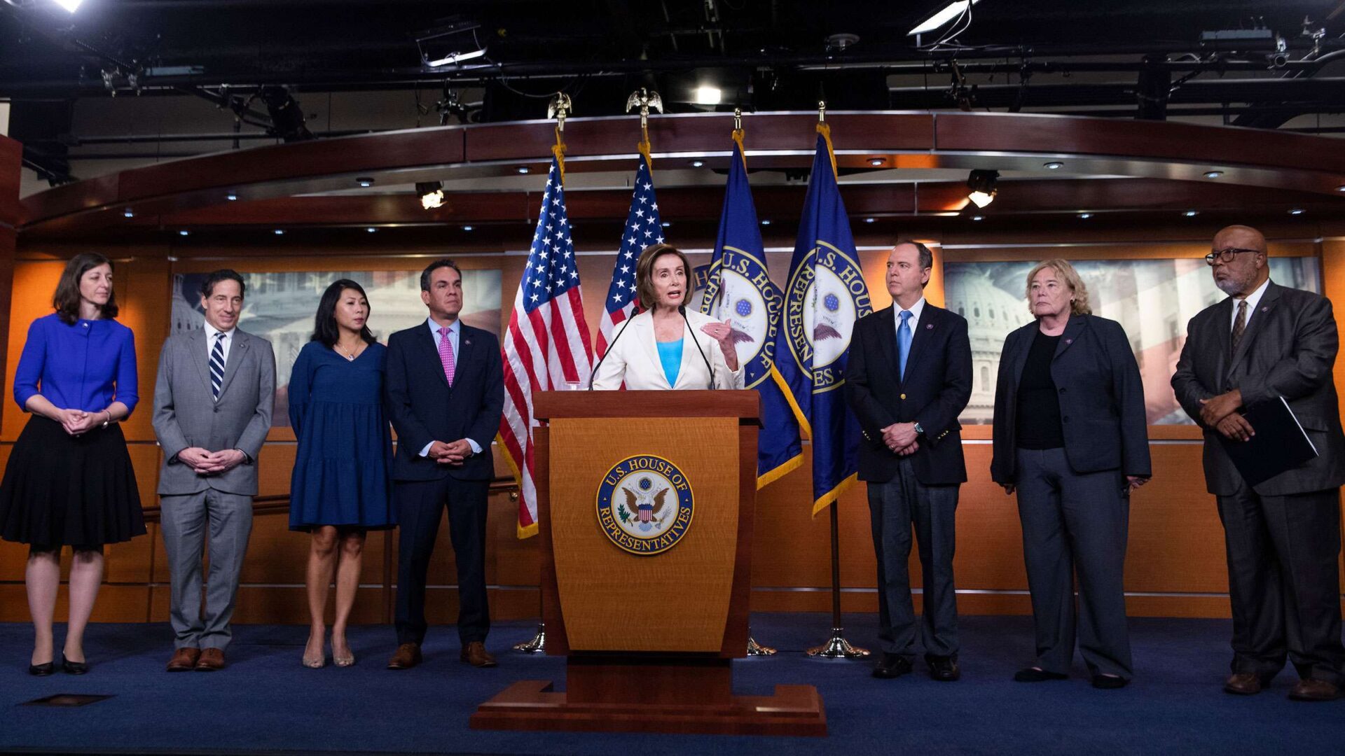 Speaker Nancy Pelosi, at podium, on Thursday introduced Democratic members of the select committee to investigate the Jan. 6 attack on the Capitol. From left: Reps. Elaine Luria of Virginia; Jamie Raskin of Maryland; Stephanie Murphy of Florida; Californians Pete Aguilar, Adam B. Schiff and Zoe Lofgren; and Bennie G. Thompson of Mississippi. Rep. Liz Cheney, R-Wyo., will also be a member.