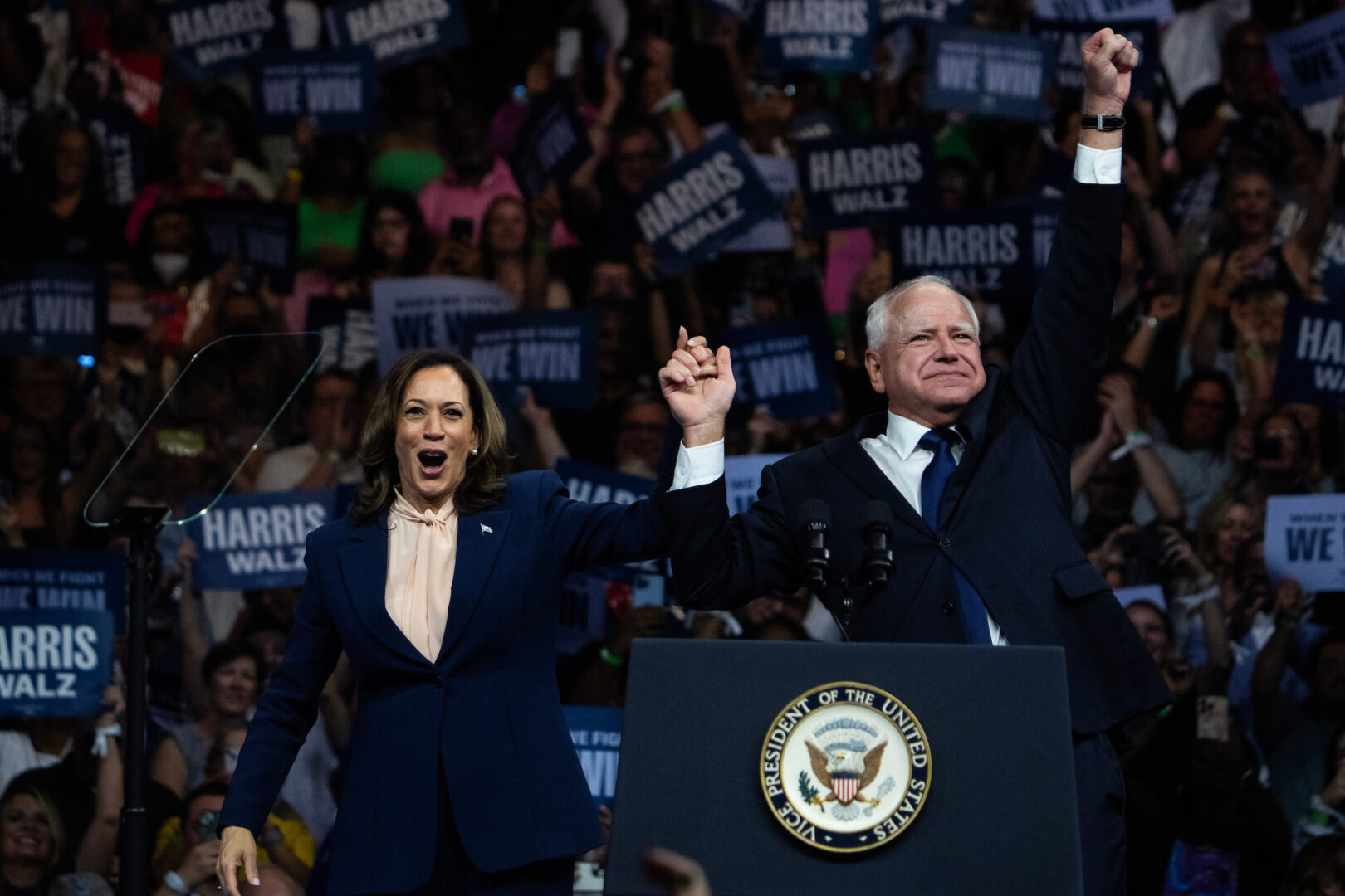 ‘Mind your own damn business’: Harris, Walz make debut at rowdy rally ...