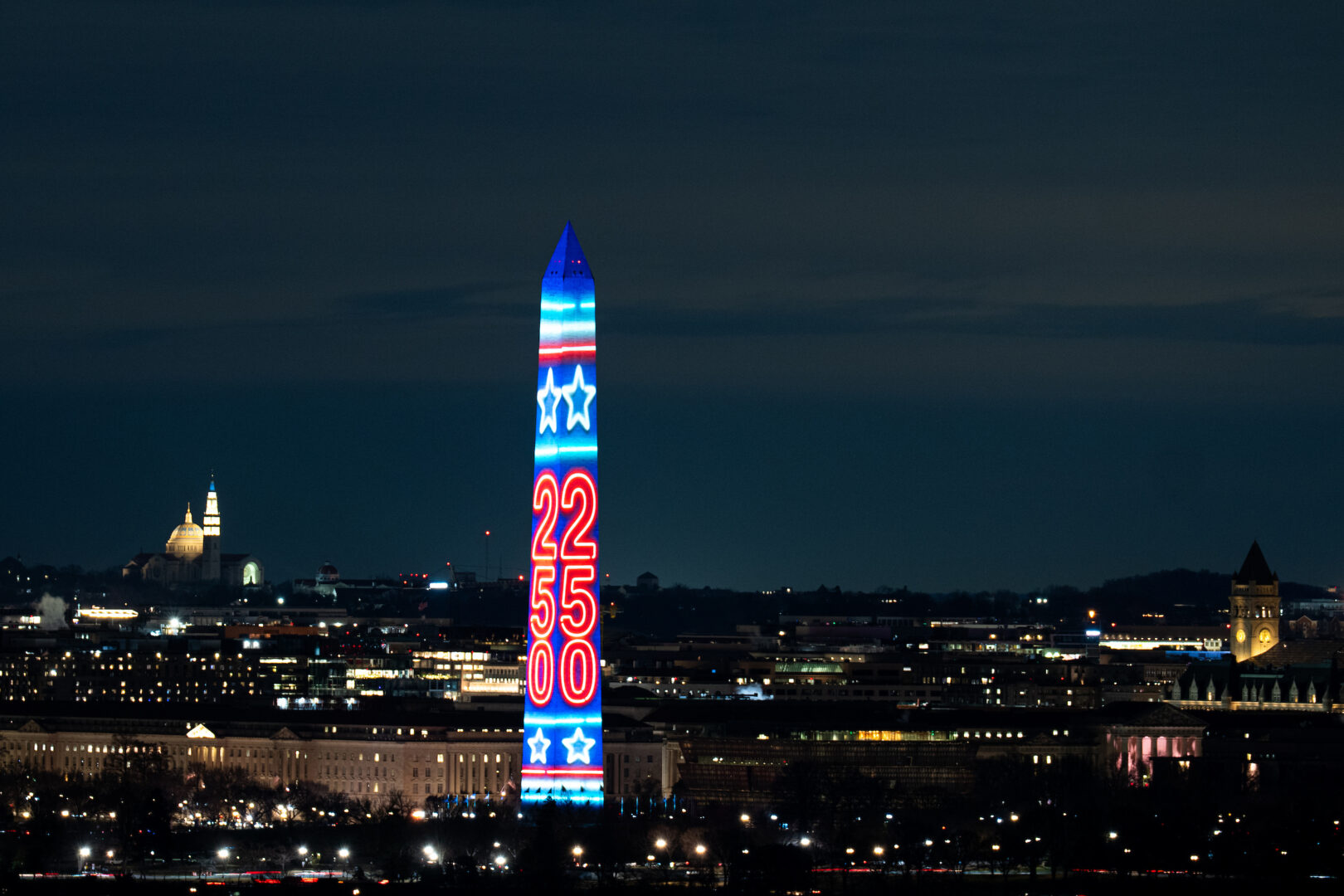 The Washington Monument is illuminated with 250   in Washington on Dec. 31, 2025. The four-sided projection light show on the Washington Monument, plus fireworks at midnight, are the official kickoff for the 250th anniversary of the United States in 2026. 