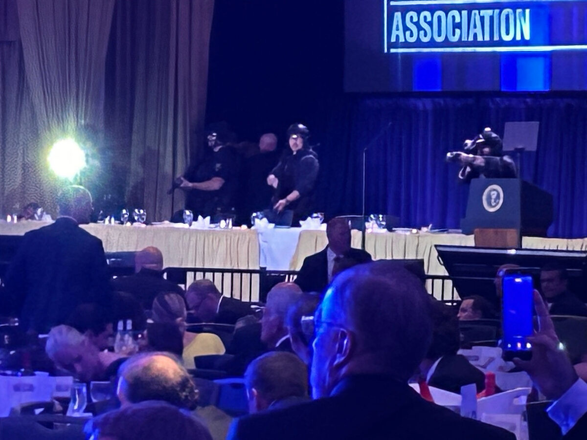 Guests and armed security agents are seen during the White House Correspondents’ Association dinner after a gunman tried to enter the ballroom of the Washington Hilton on Saturday. (Jason Dick/CQ Roll Call)