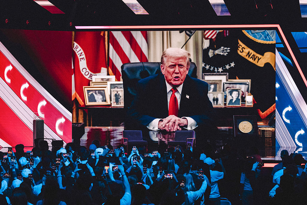 A prerecorded message from President Donald Trump is played during Turning Point USA's annual AmericaFest conference in Phoenix, Ariz., on Dec. 21.