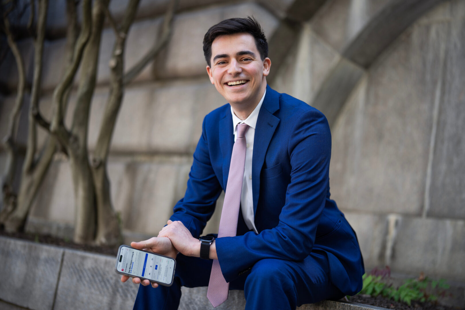 Zach Florman, communications director for Rep. Laura Friedman, D-Calif., is photographed outside of Longworth building on Thursday, April 23, 2026. Florman displays the screen of a bot he built  to track House floor action in real-time.