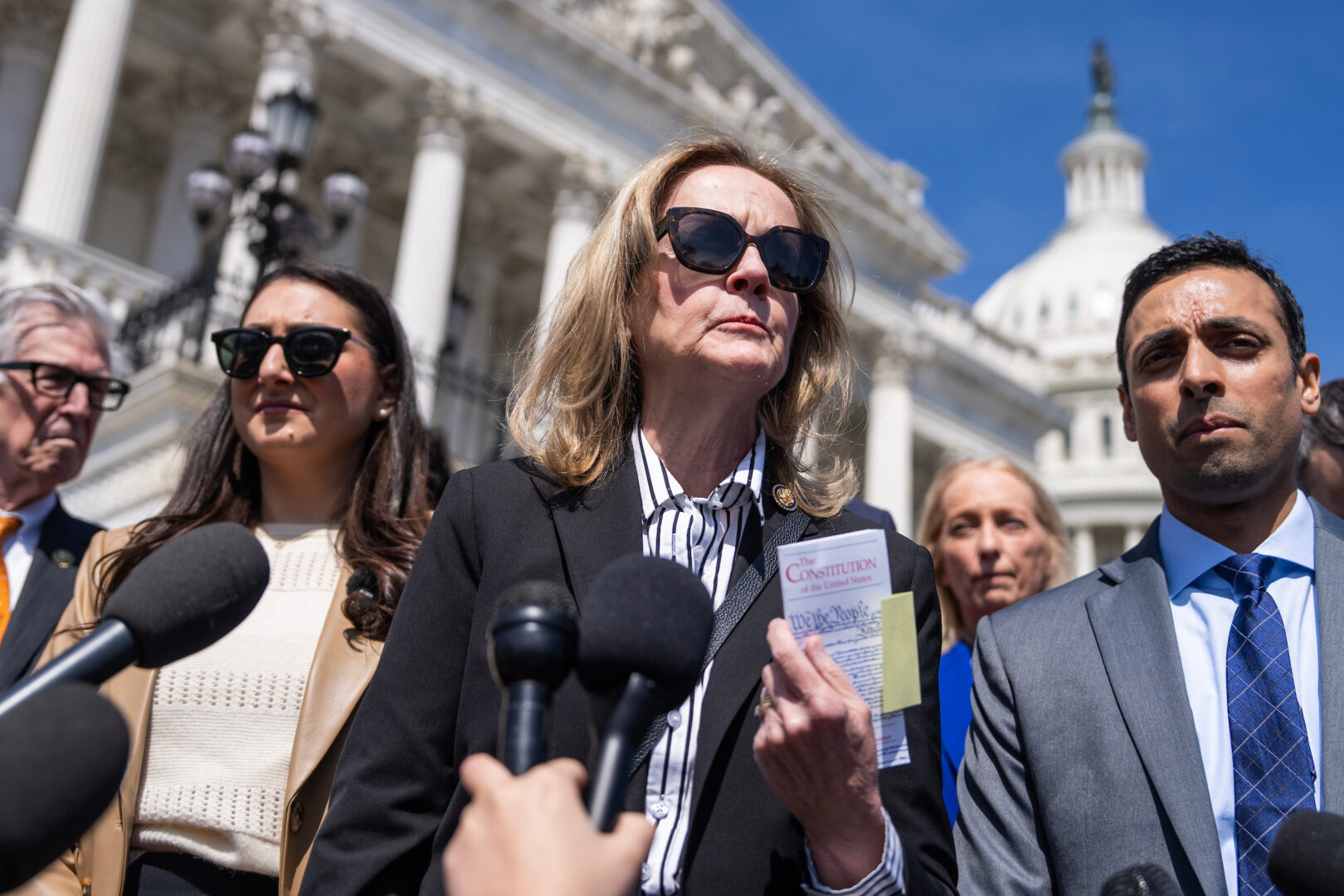 Pennsylvania Rep. Madeleine Dean, center — seen at a news conference at the Capitol on April 9 — has previously voiced objections about the lack of guidelines for an  American First Opportunity Fund in the State Department's budget.