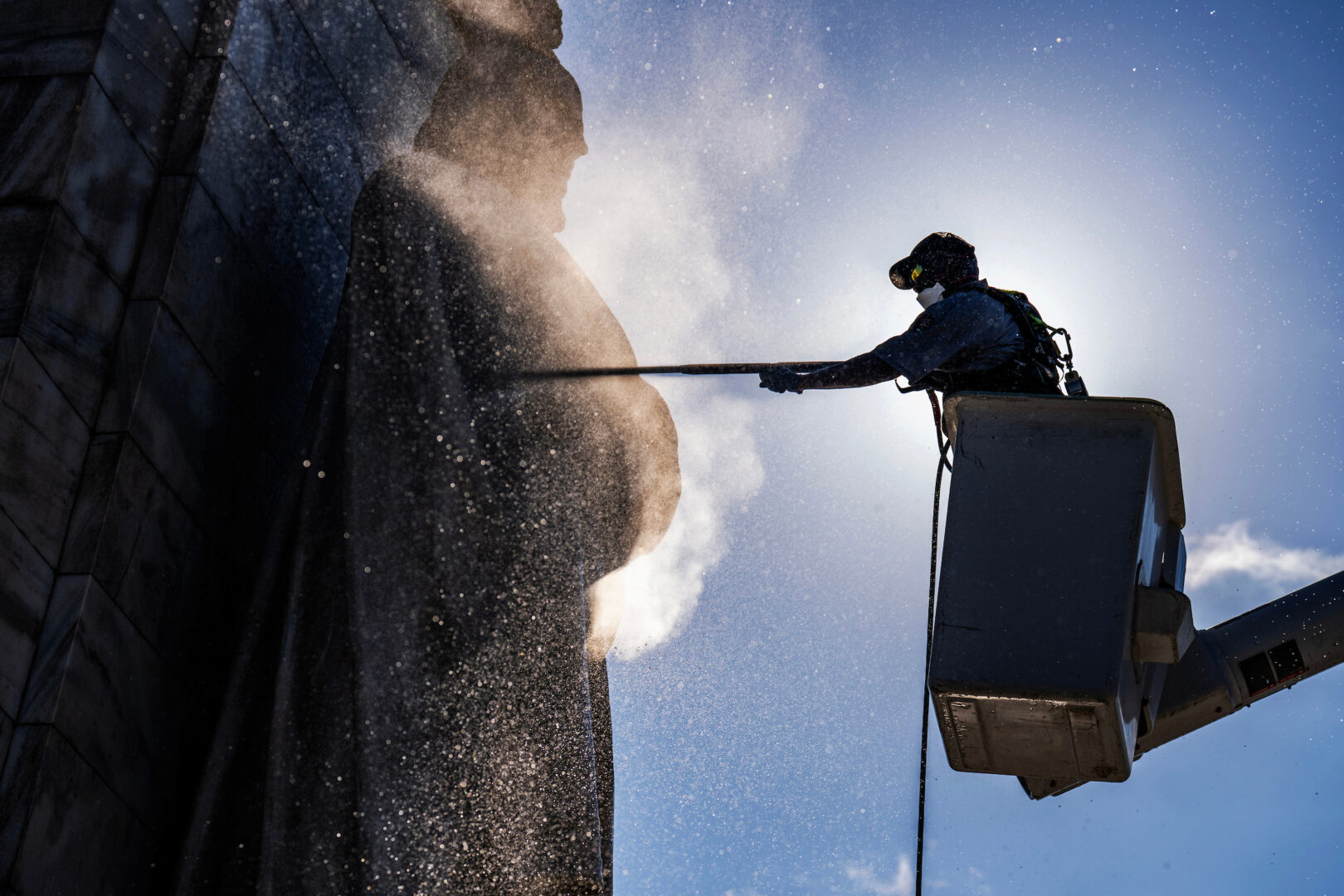 A National Park Service worker washes the Columbus Fountain outside of Union Station on July 24, 2025.