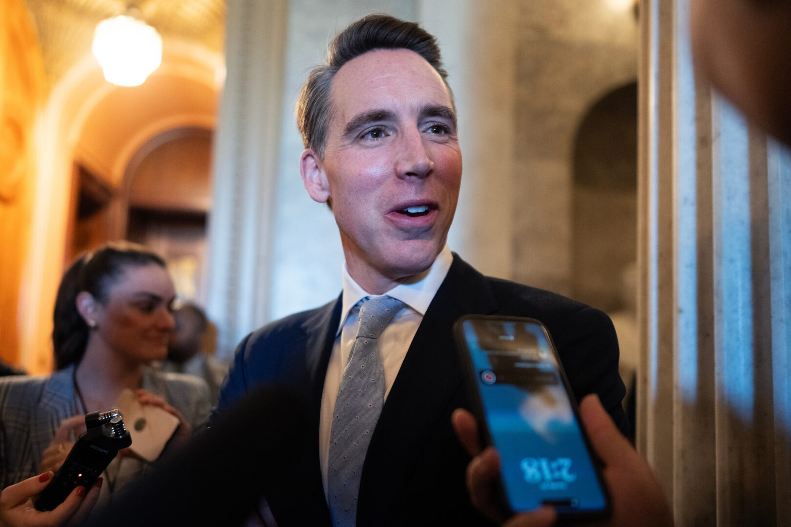 Sen. Josh Hawley, R-Mo., talks with reporters in the Capitol in March.