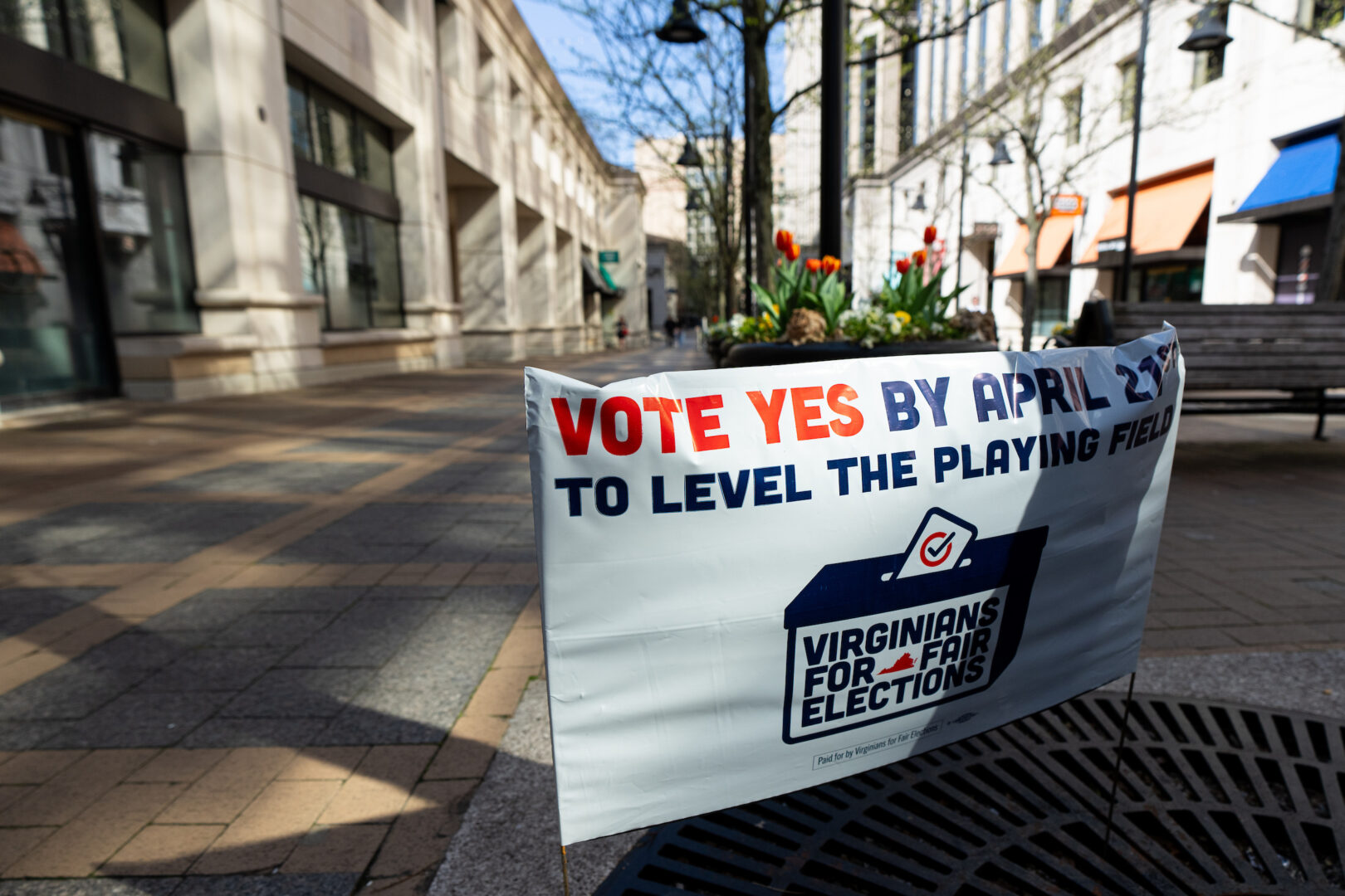 A sign urges early voters to vote “yes” on the Virginia redistricting referendum at the Ellen M. Bozman Government Center in Arlington, Va., last month. 
