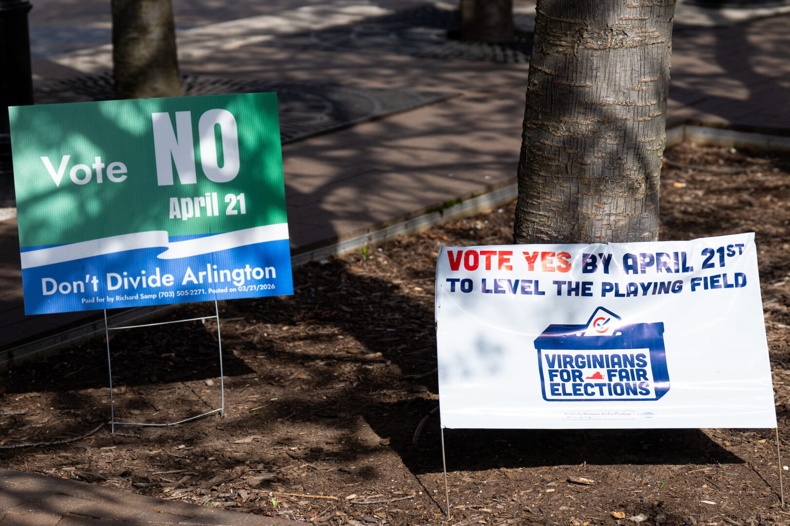 Signs urge early voters to vote yes or no on the Virginia redistricting referendum at the Ellen M. Bozman Government Center in Arlington, Va., March 31. 