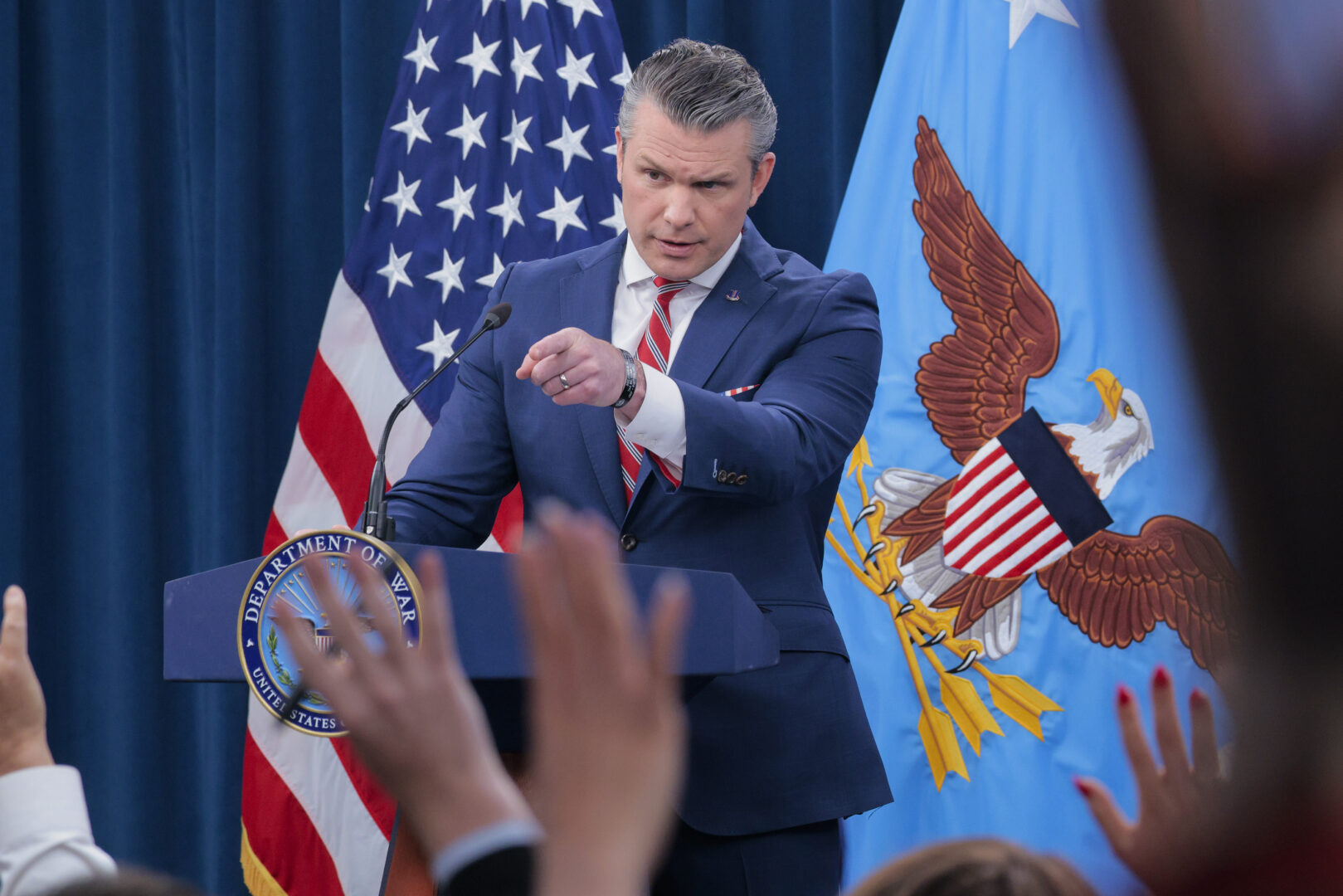 Defense Secretary Pete Hegseth takes questions during a press briefing at the Pentagon on Tuesday. (Chip Somodevilla/Getty Images)