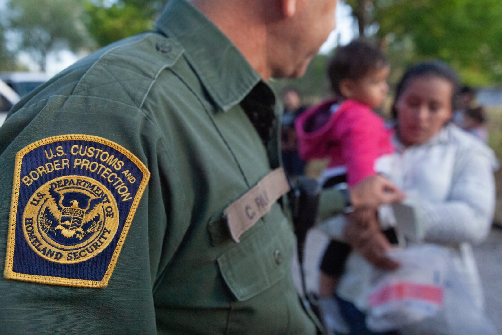 Customs and Border Protection would get $26 billion in the bill. Above, a CBP agent processes migrants that recently crossed the border in the Rio Grande Valley sector of Texas in 2019. (Jinitzail Hernández/CQ Roll Call)