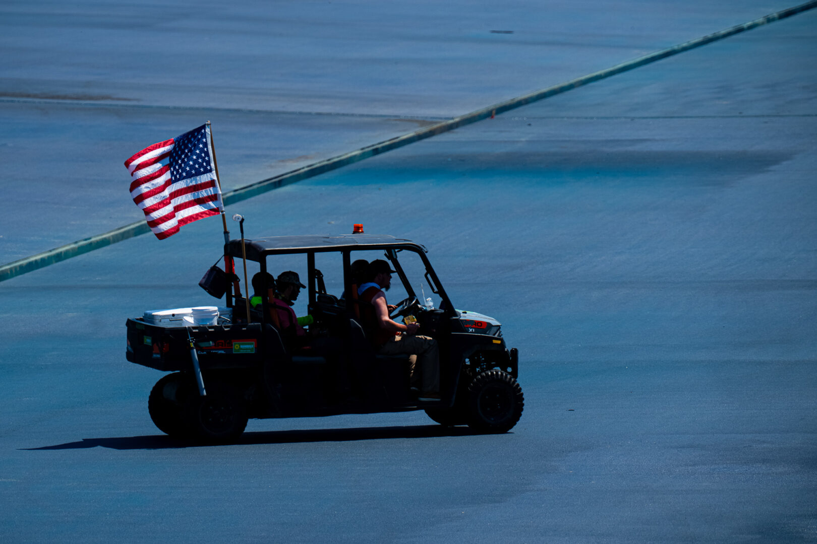 Work continues on painting the National Mall's Reflecting Pool blue on Monday. The paint job is slated to be completed by the 250th anniversary of the United States on July 4th. (Bill Clark/CQ Roll Call)