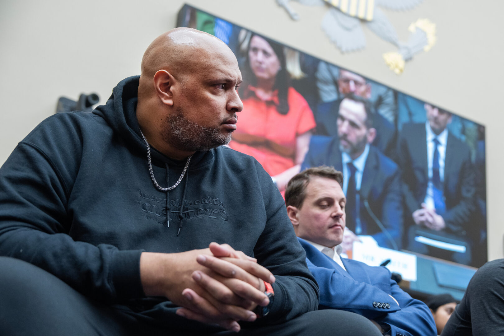 Former Capitol Police officer Harry Dunn, left, and MPD officer Daniel Hodges, listen to former special counsel Jack Smith testify during a House Judiciary Committee hearing Jan. 22. The two have sued to block the Trump administration from making payments out of the fund, arguing it would be used to “finance the insurrectionists and paramilitary groups.” 

