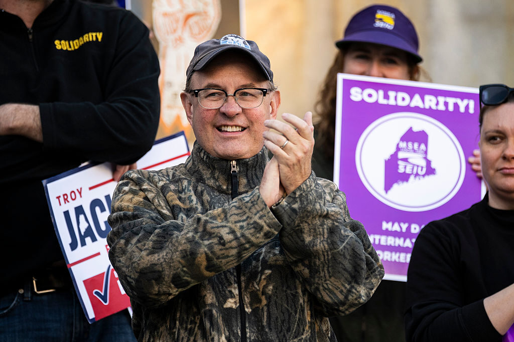 Maine State Auditor Matt Dunlap applauds during a May Day rally organized by local unions outside Portland City Hall. (Graeme Sloan/Getty Images)