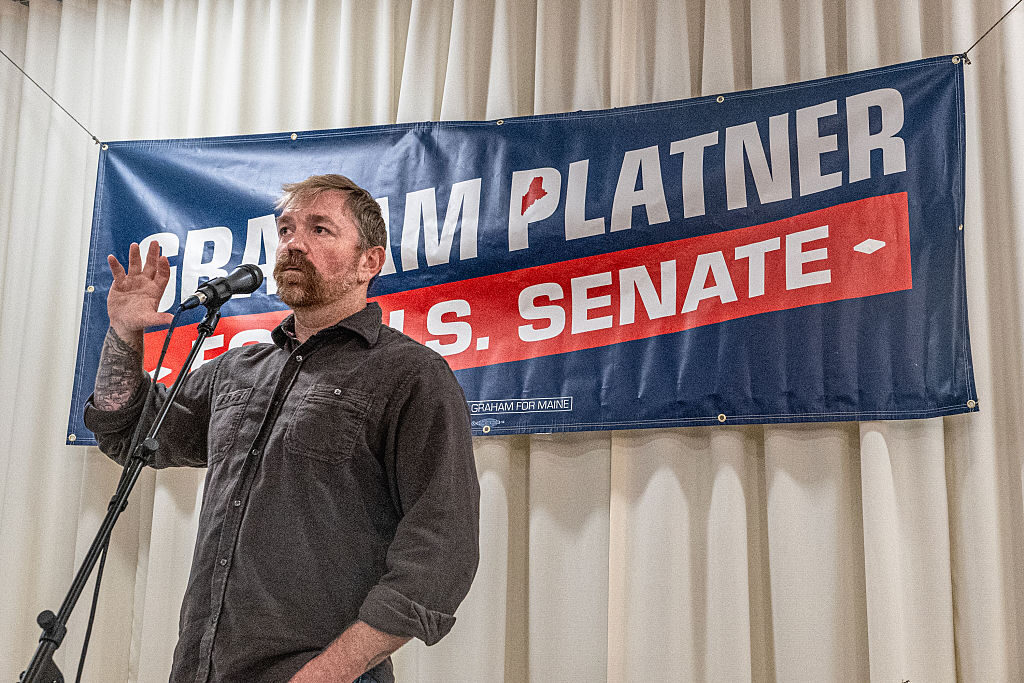 Democratic Senate candidate Graham Platner speaks to voters Sunday at a town hall in Portland, Maine. (Laura Brett/Getty Images)