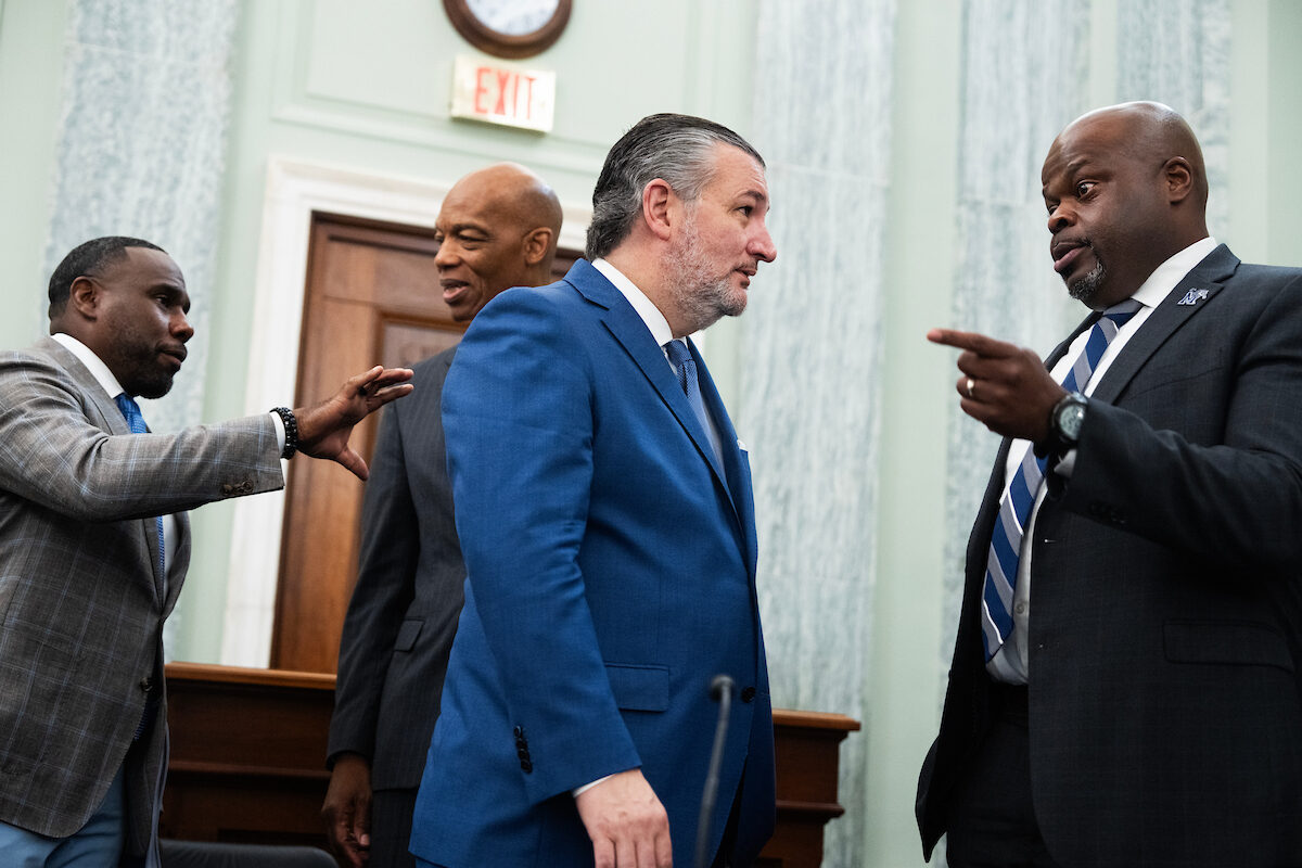Derek Mason, head football coach at Middle Tennessee State University; James Crawford III, president of Texas Southern University; Chairman Ted Cruz, R-Texas; and Charles Huff, head football coach at the University of Memphis talk Wednesday after a Senate Commerce Committee roundtable on college sports legislation.