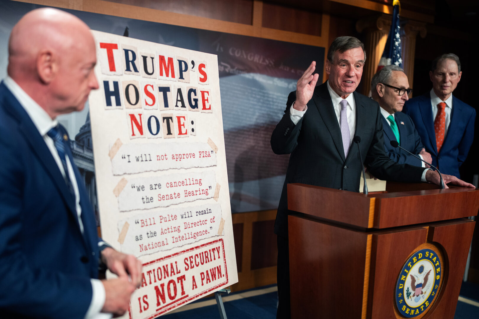 Senate Intelligence ranking member Mark Warner and other Democrats conduct a news conference in the Capitol on Wednesday, after President Trump tapped the brakes on Jay Clayton, his nominee for director of national intelligence.