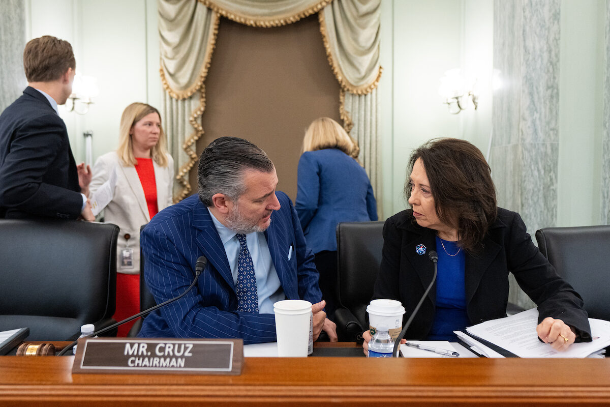 Senate Commerce Chairman Ted Cruz, R-Texas, and ranking member Maria Cantwell, D-Wash., talk before the start of a June 18 markup of a college sports bill the duo primarily wrote. 
