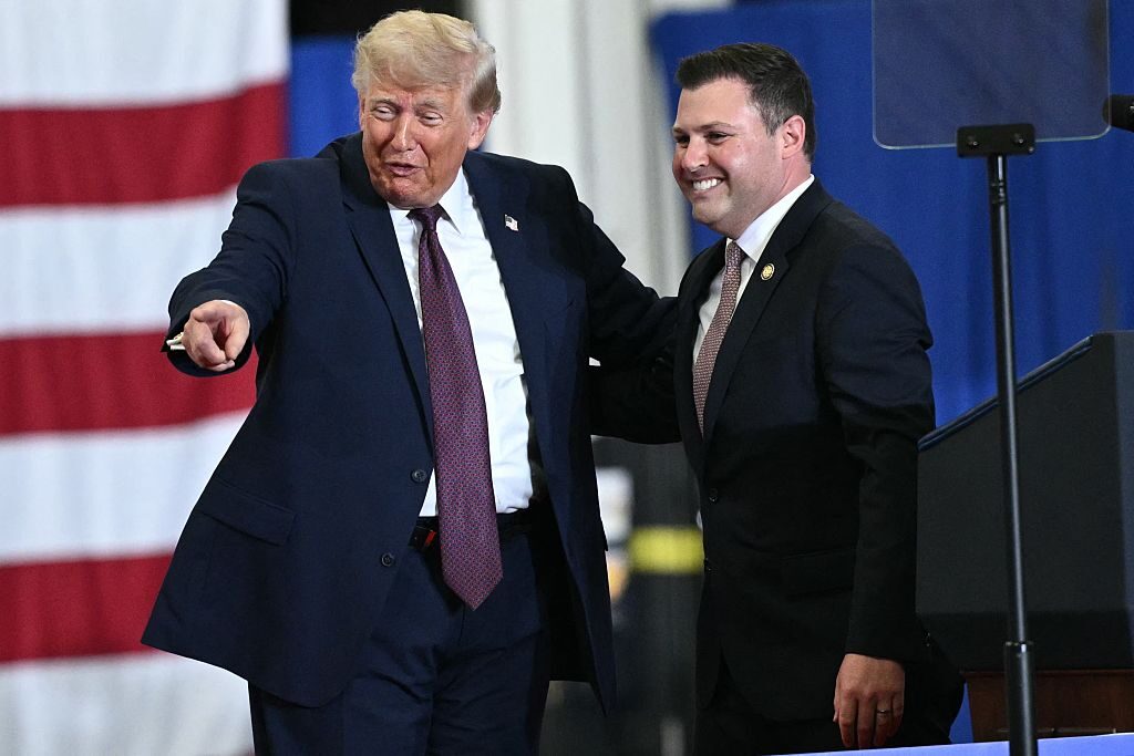 President Donald Trump appeared on stage with Rep. Ryan Mackenzie, R-Pa., during a visit to the a Mack Trucks manufacturing facility in Macungie, Pa., on June 23. (Mandel Ngan/AFP via Getty Images)