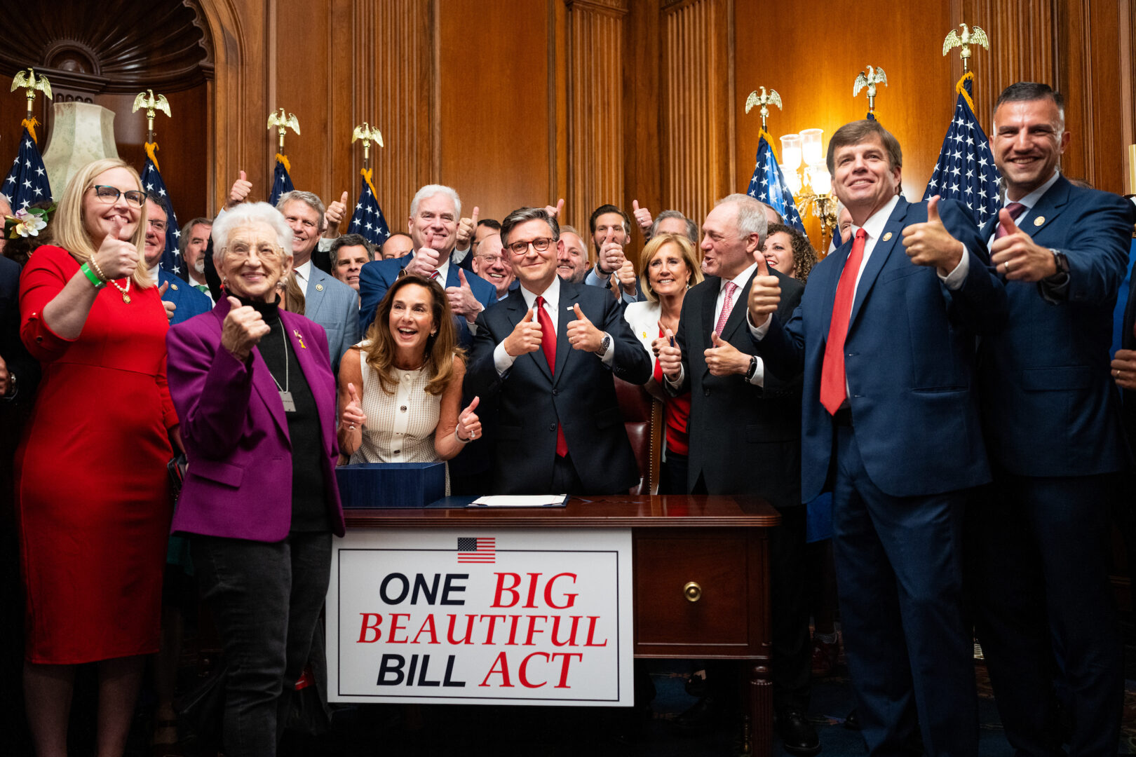 Speaker Mike Johnson, R-La., and House Republicans give a thumbs up during the enrollment ceremony of President Trump’s One Big Beautiful Bill Act after the bill passed in the U.S. Capitol on Thursday, July 3, 2025.