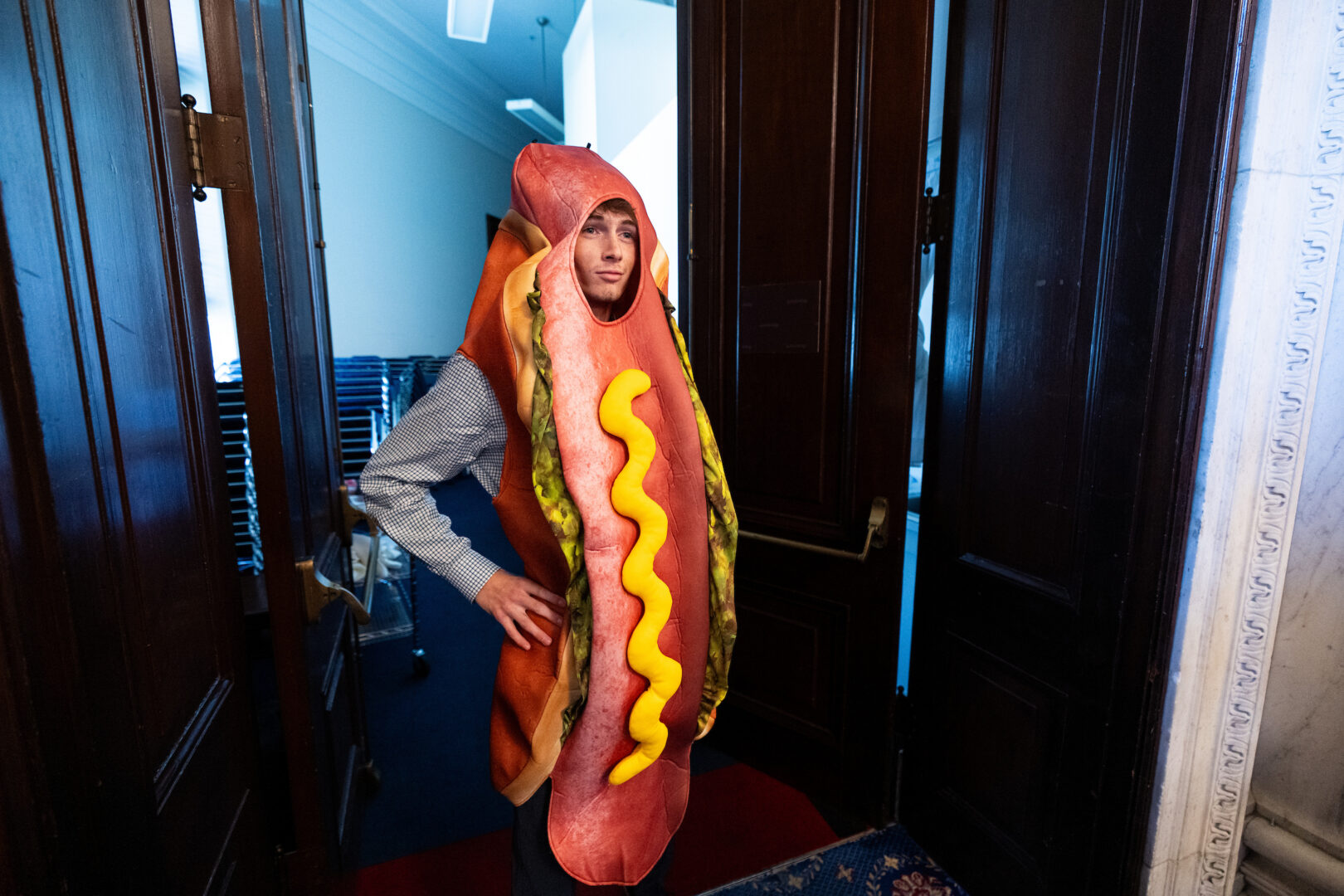 Alex Forsberg, an intern in Sen. Elissa Slotkin’s office, dons a hot dog costume at the "Taste of Michigan" event in the Russell Senate Office Building on Wednesday.