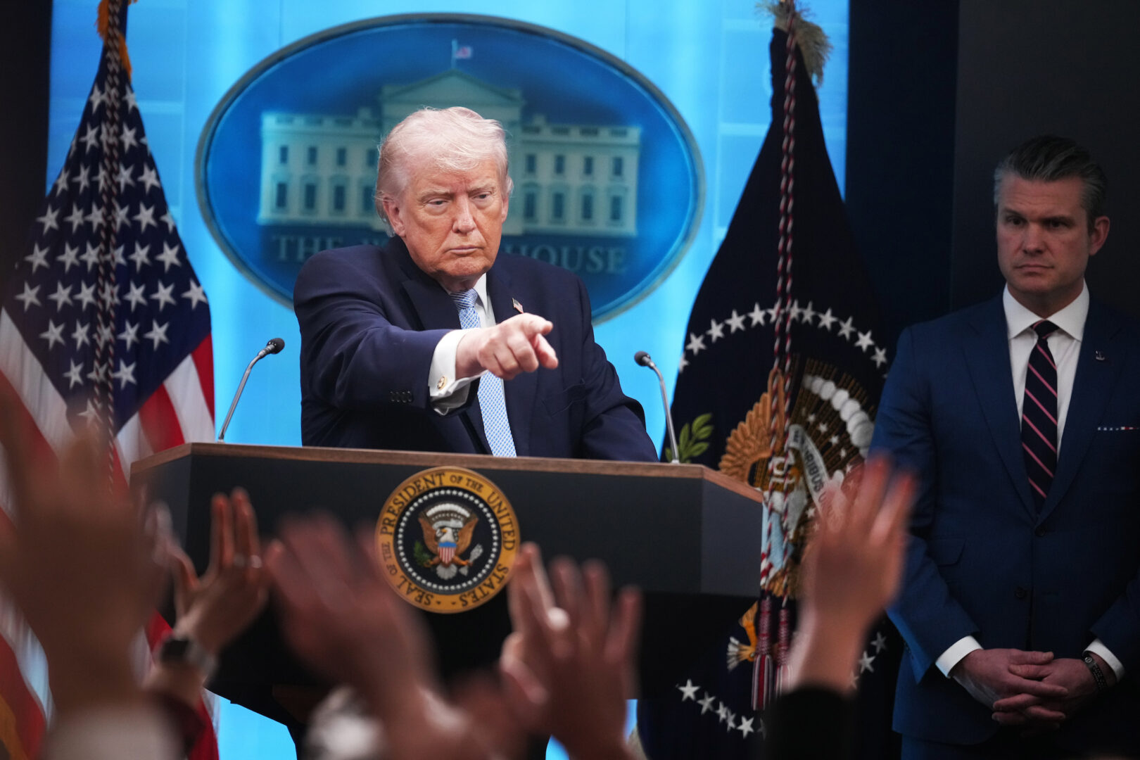 President Donald Trump and Defense Secretary Pete Hegseth conduct a news conference in the White House briefing room on April 6.