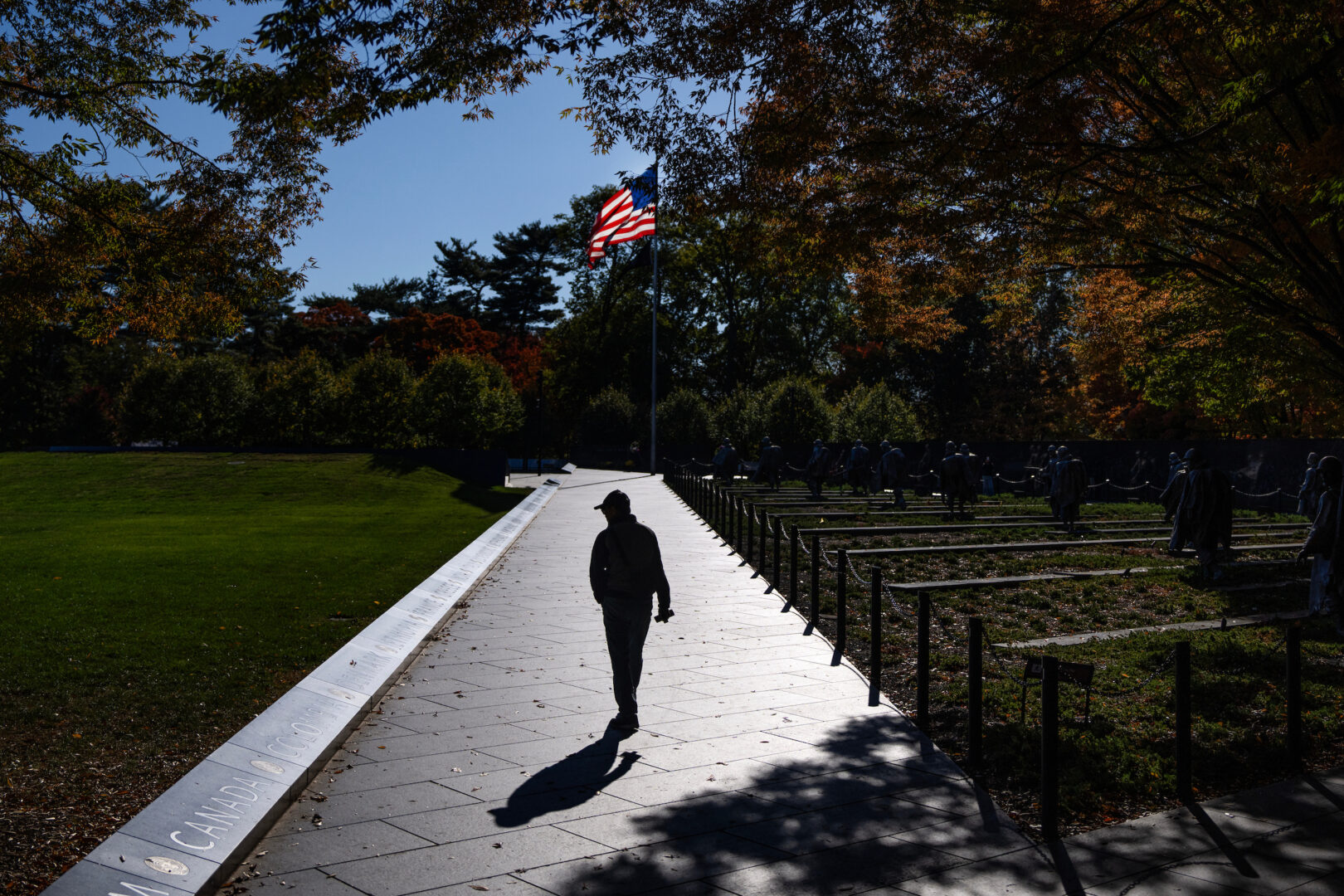 A visitor tours the Korean War Veterans Memorial during a government shutdown on Oct. 20, 2025.
