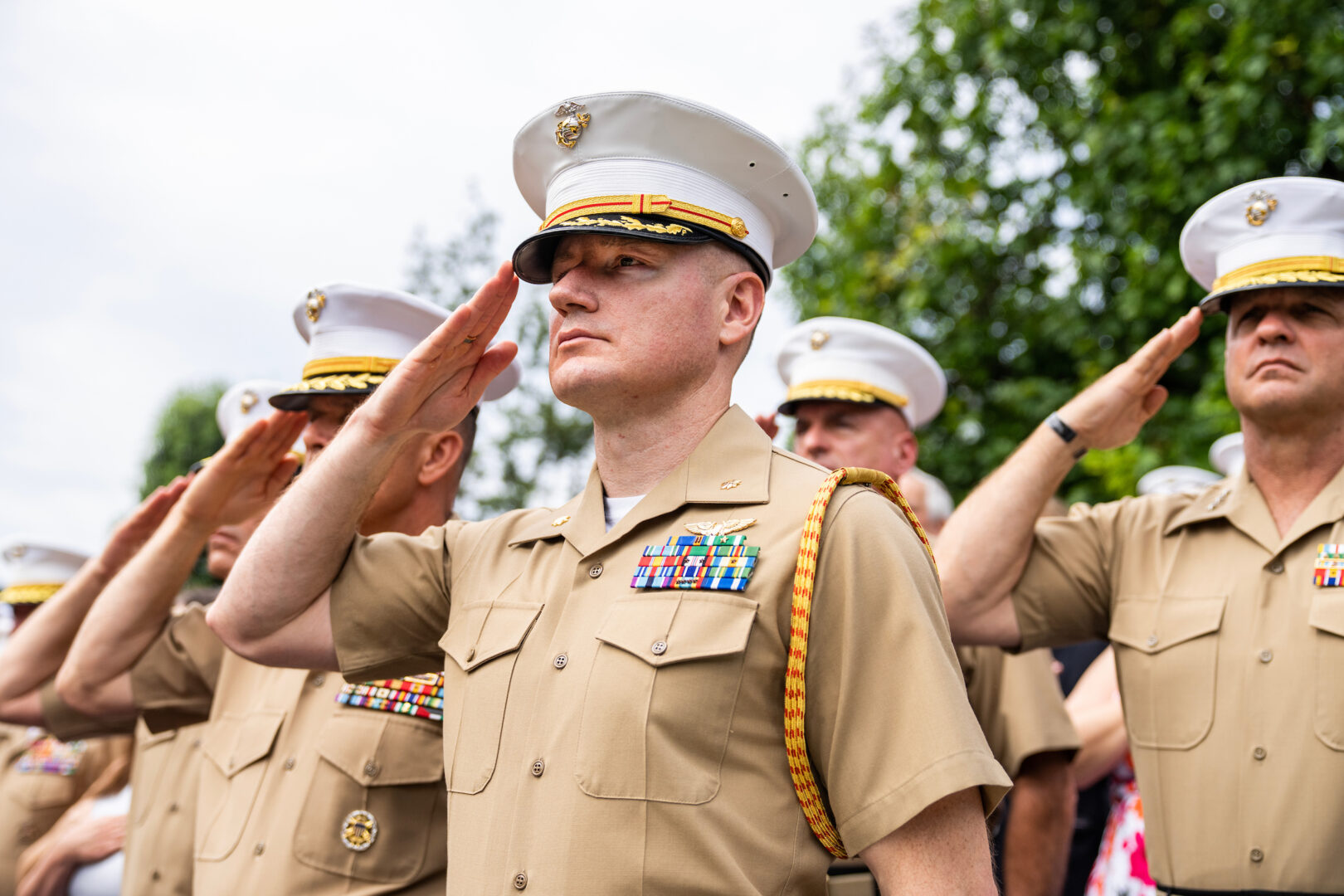 Marines salute during a ceremony at the Marine Barracks Washington on July 10, 2023. 